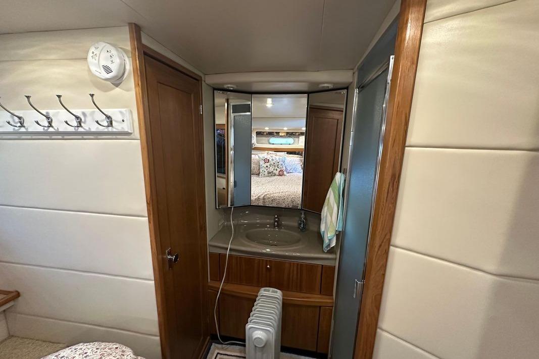 Interior of 2000 Bayliner 4087 Aft Cabin Motoryacht with vanity and mirror.