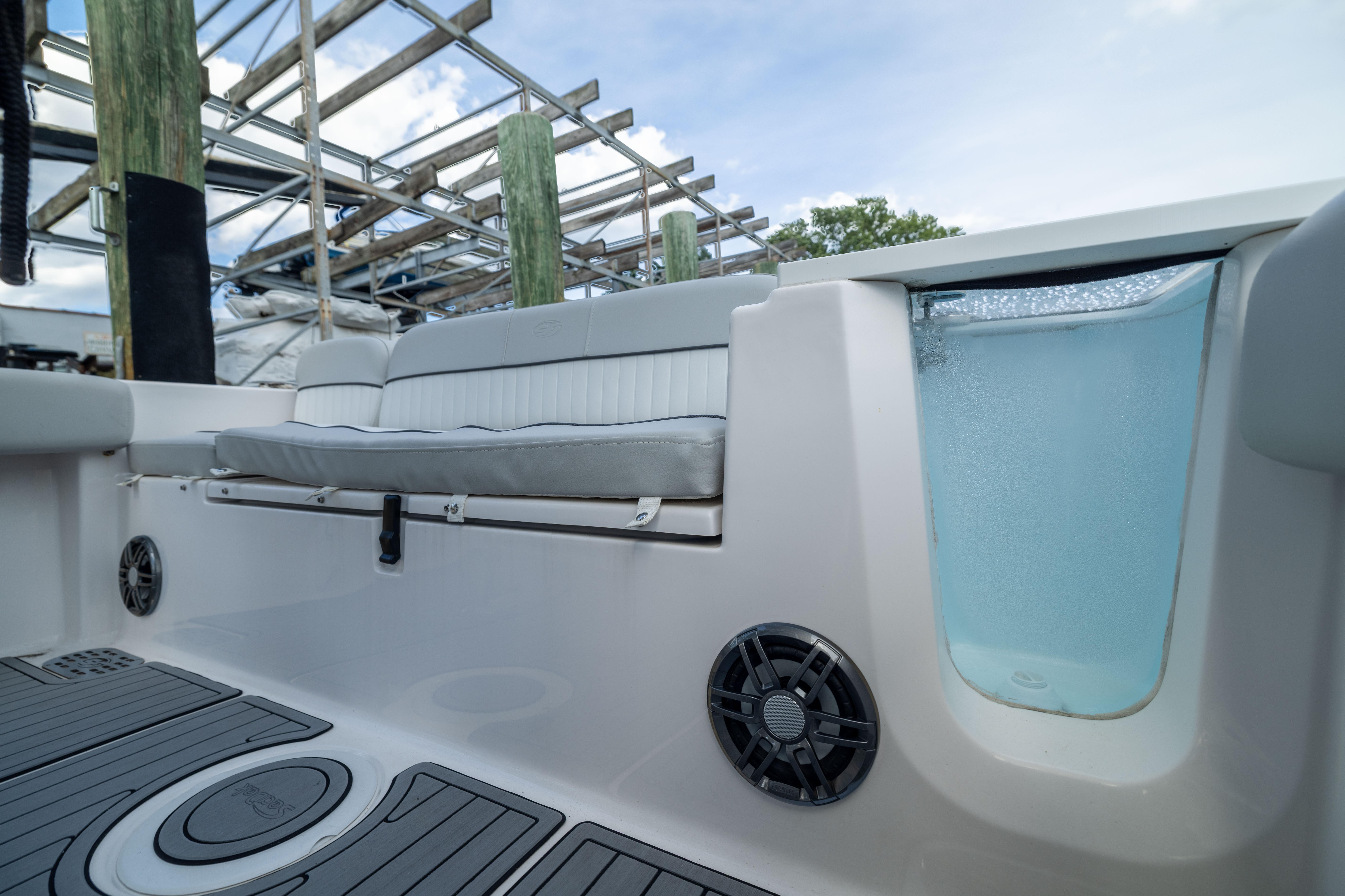 2023 Sea Fox 228 Commander boat interior with seating and livewell.