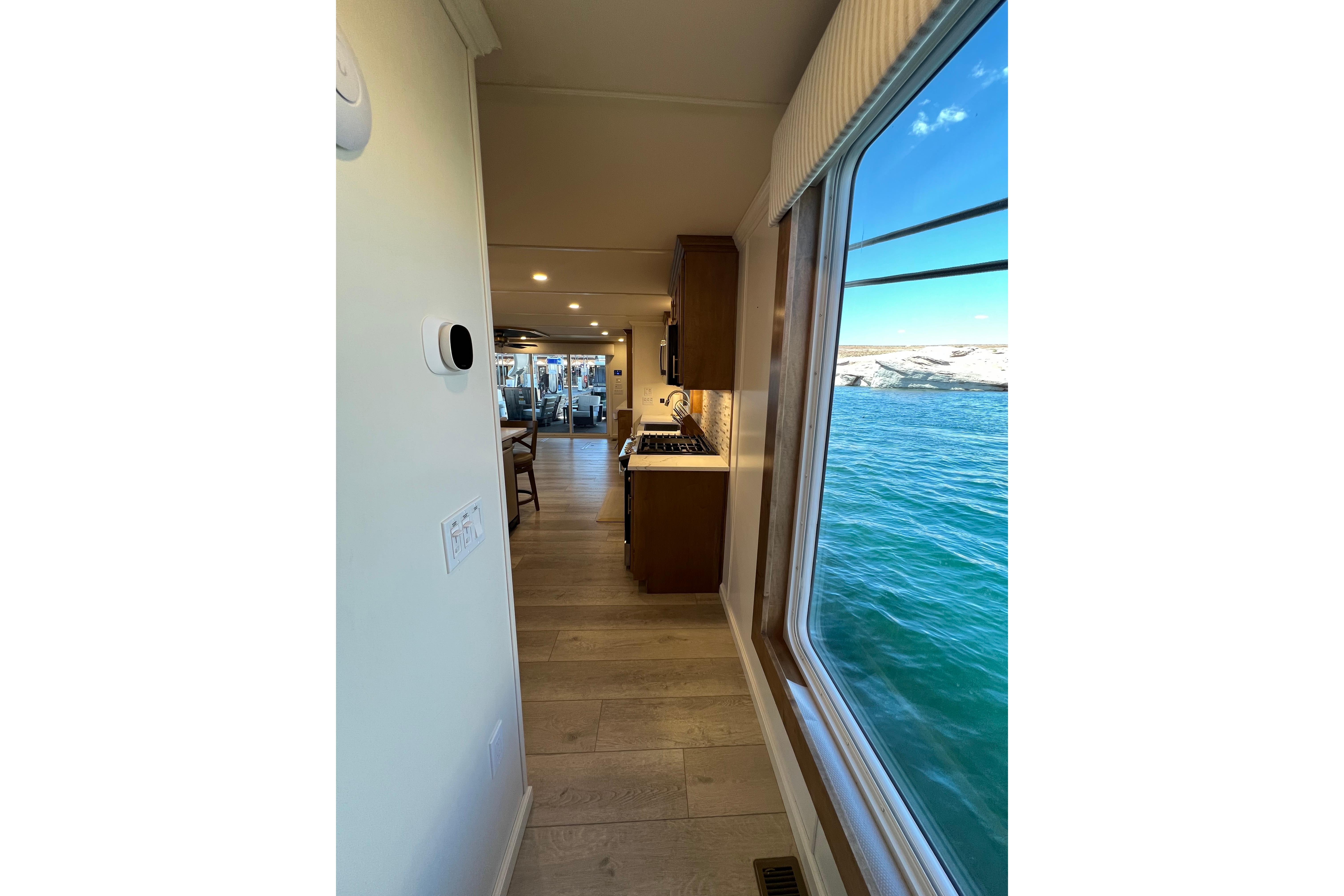 Interior view of 2025 Sumerset Excellence Multiple Shares houseboat with scenic water view.