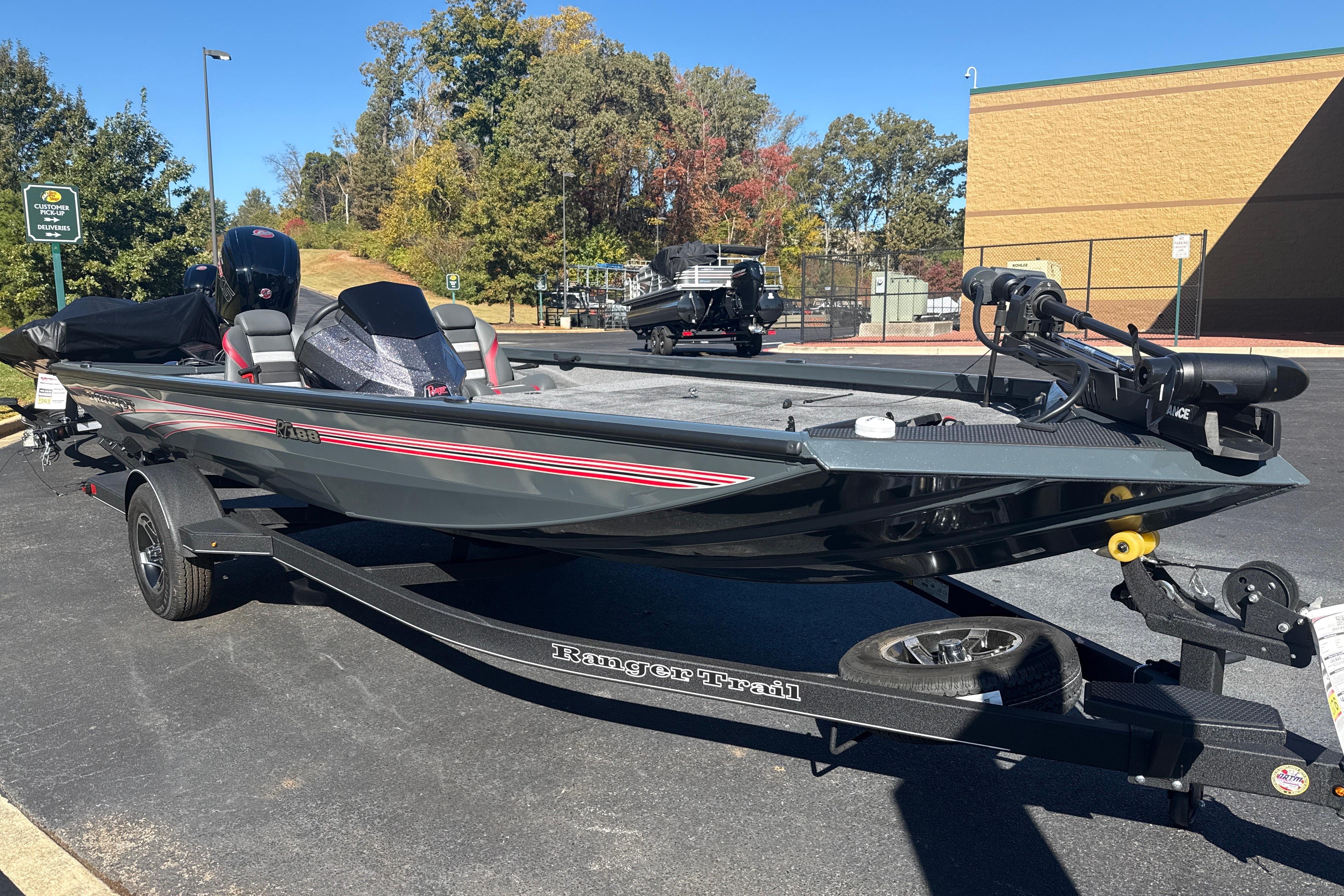 2025 Ranger RT188 boat on trailer in parking lot, sunny day.
