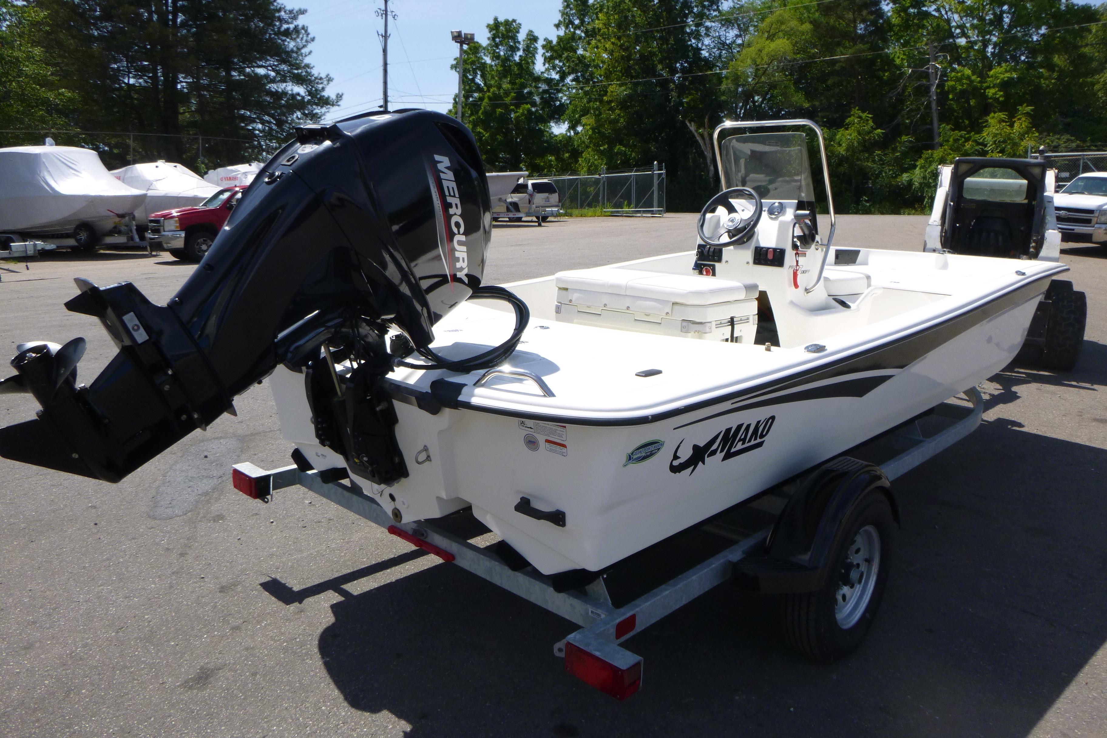 2024 Mako Pro Skiff 17 CC boat with Mercury outboard motor on trailer.