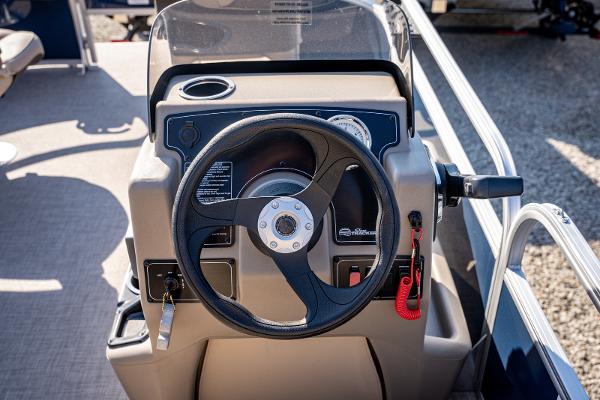 2025 Sun Tracker Bass Buggy 16 DLX steering console with controls and gauges.