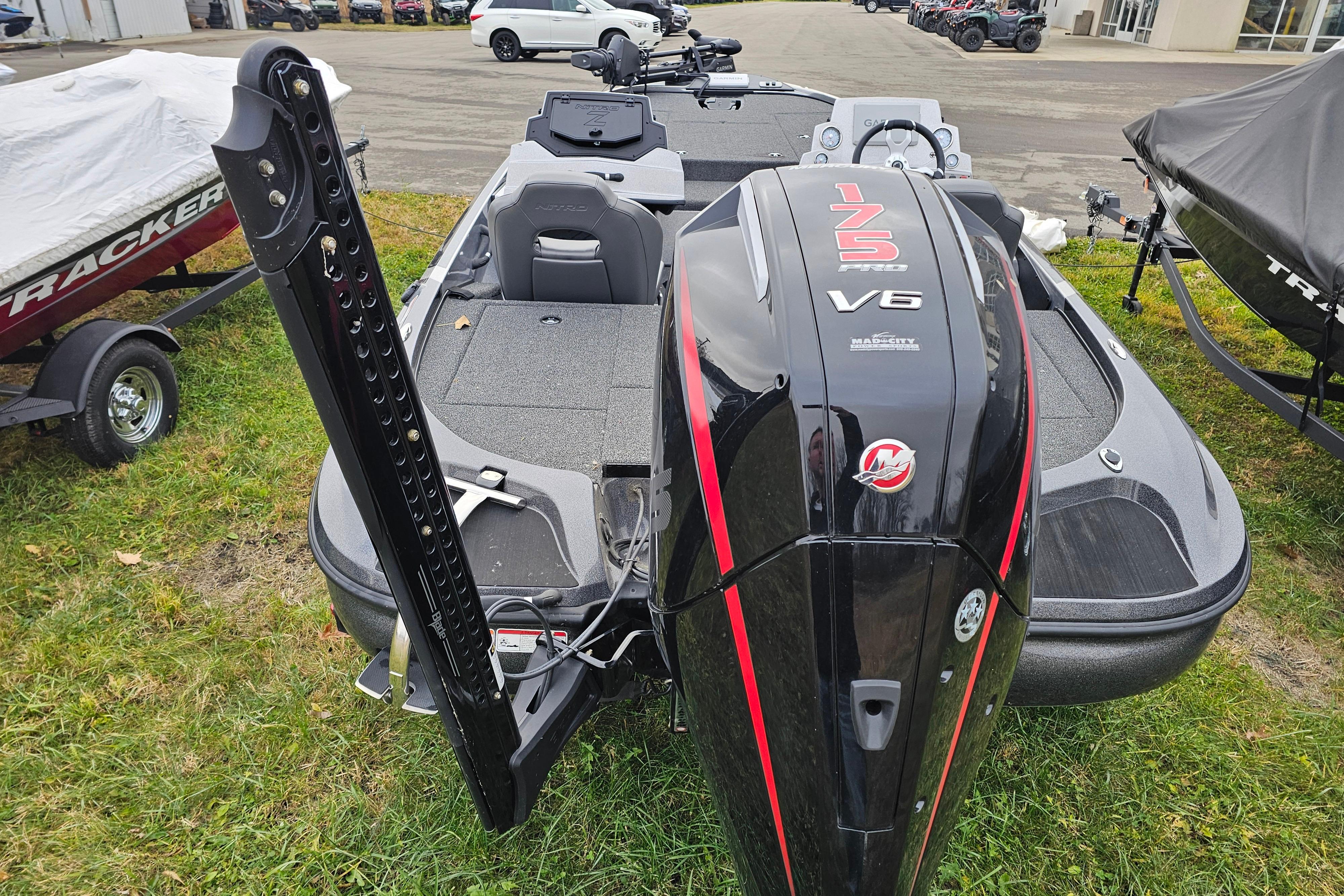 2025 Nitro Z18 Pro boat with powerful V6 engine, displayed outdoors on grass.