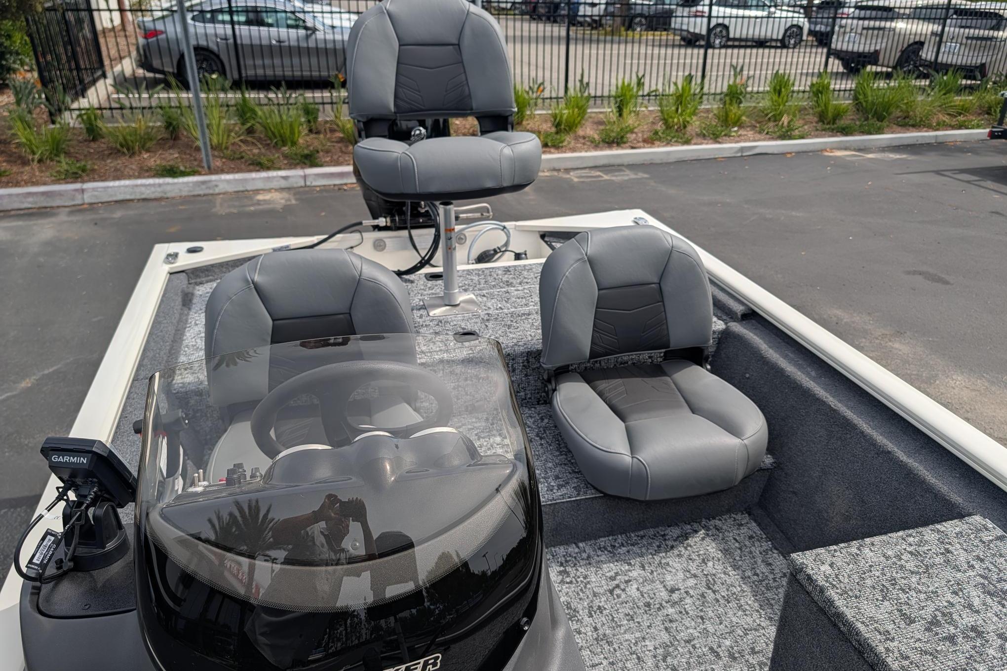 2026 Tracker Pro 170 boat interior with gray seating and Garmin navigation system.