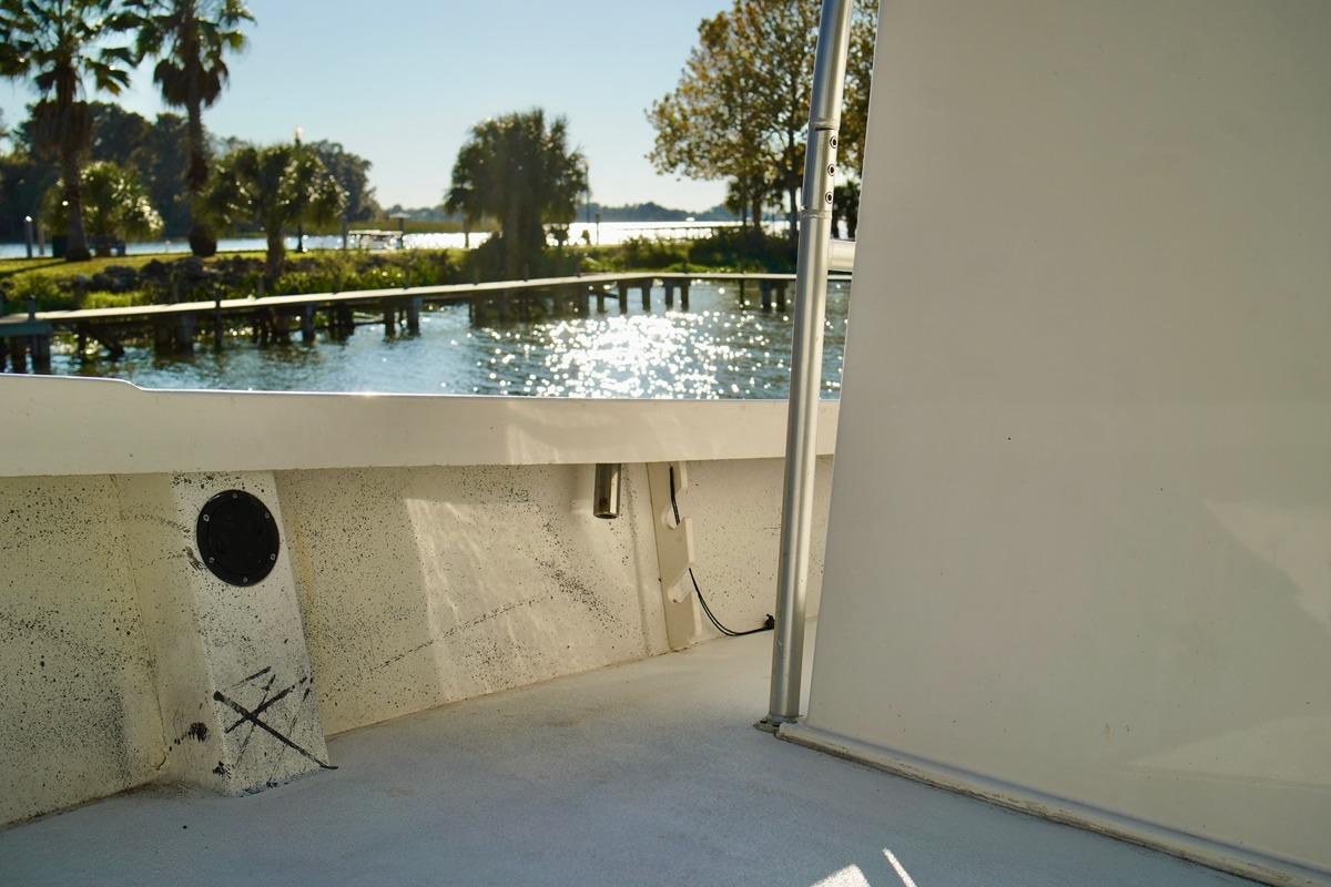 1970 Aquasport 222 Flatback boat interior with scenic waterfront view.