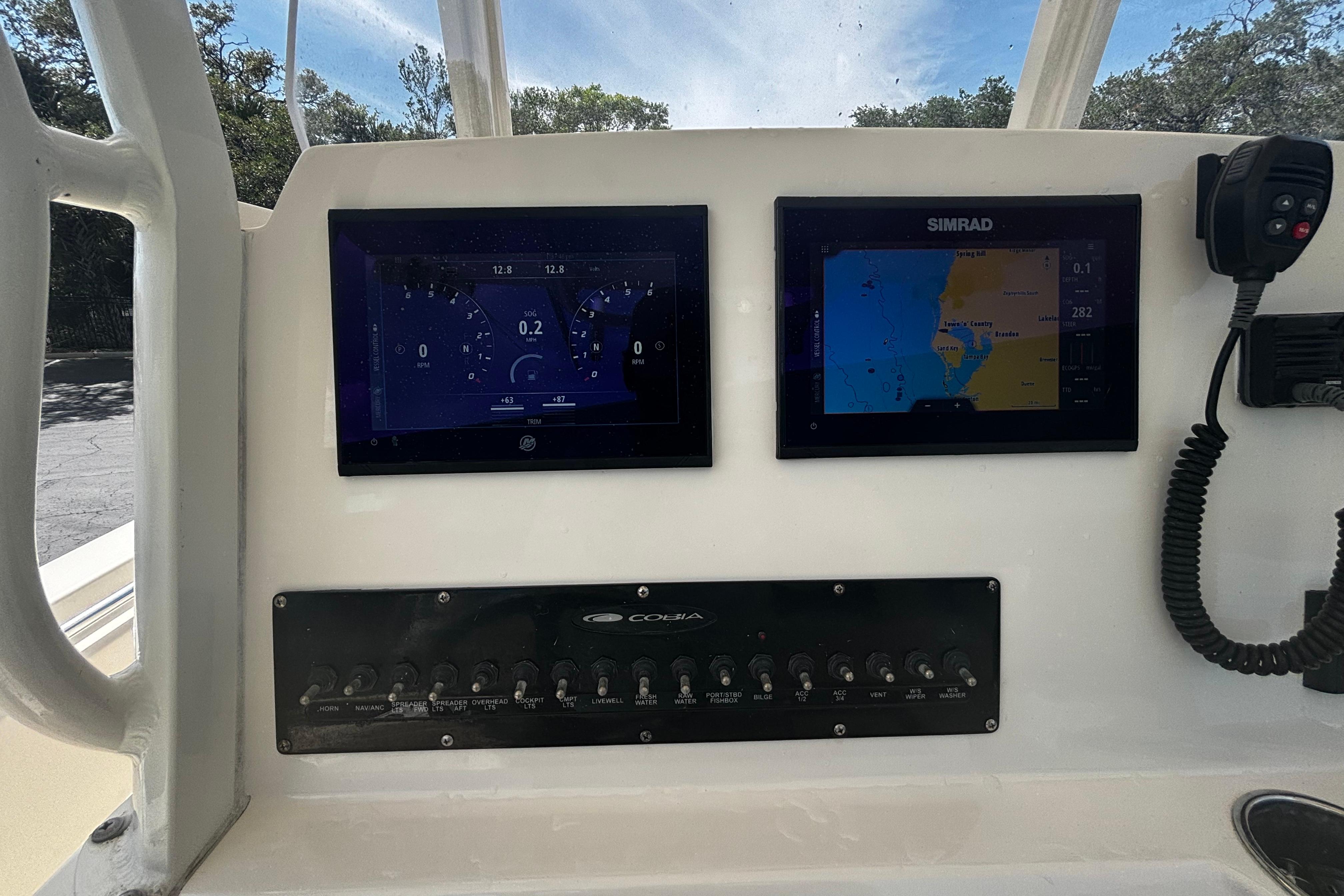2023 Cobia 262 Center Console dashboard with dual displays and control panel.