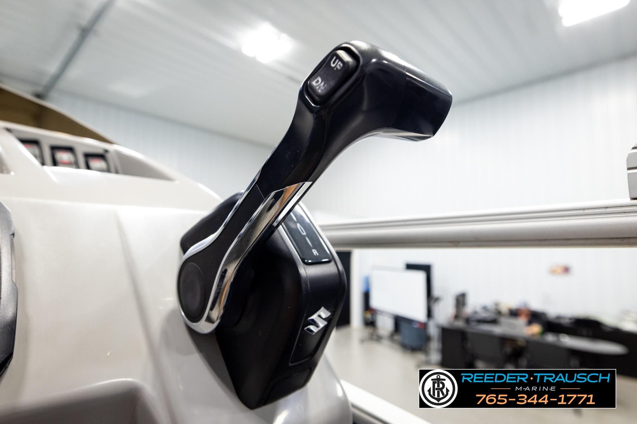 Close-up of 2021 Bennington 20 SV boat throttle control in a showroom setting.