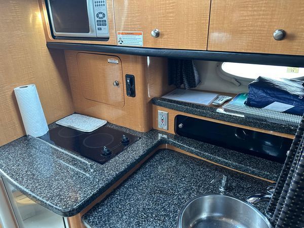 Kitchen area in a 2006 Chaparral Signature 310 yacht.