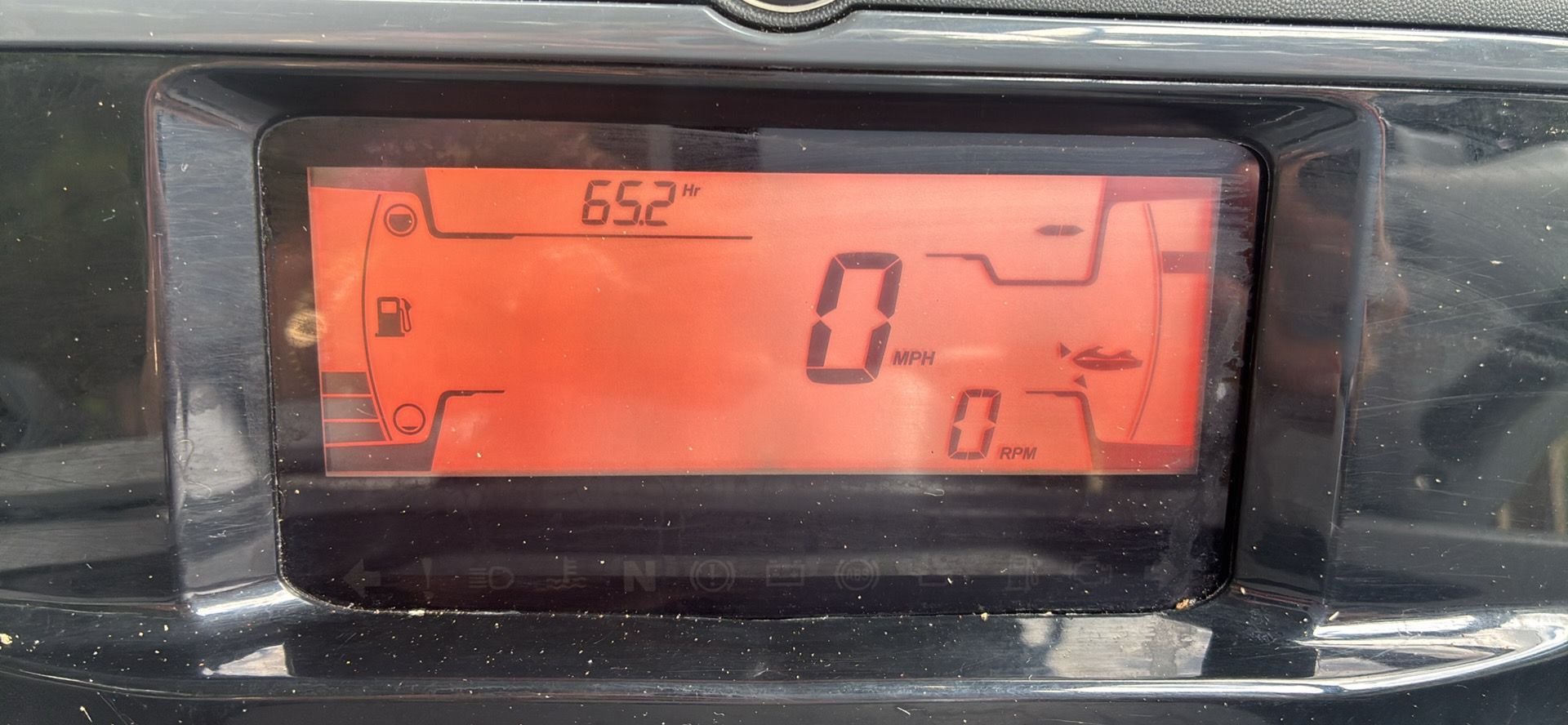 The image shows a digital dashboard displaying speed and RPM readings.