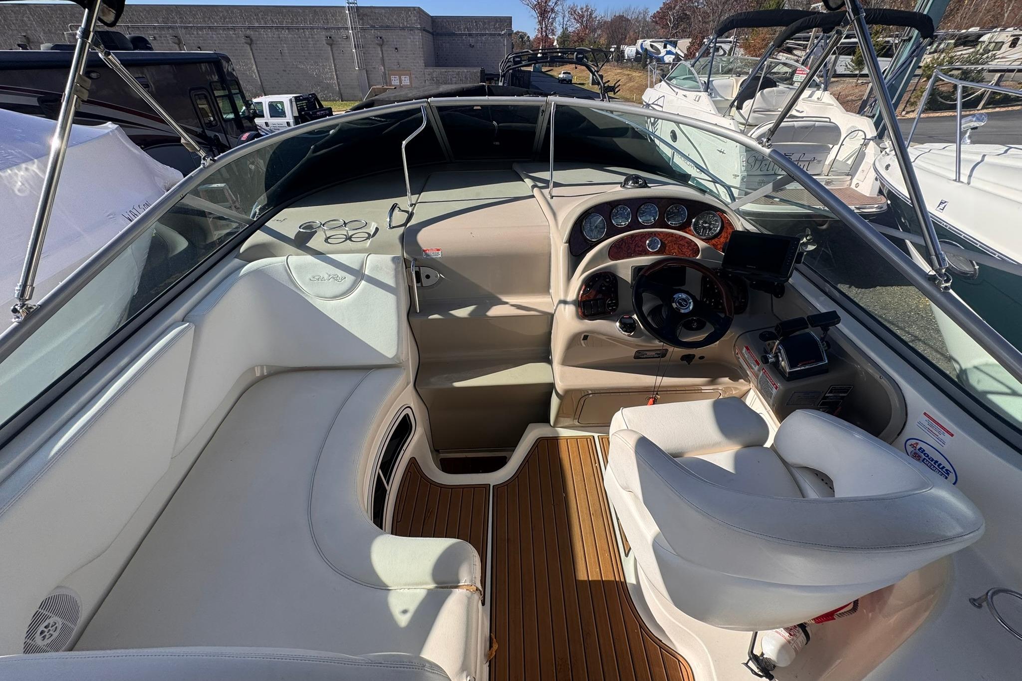 2007 Sea Ray 280 Sundancer boat interior with helm and seating area.