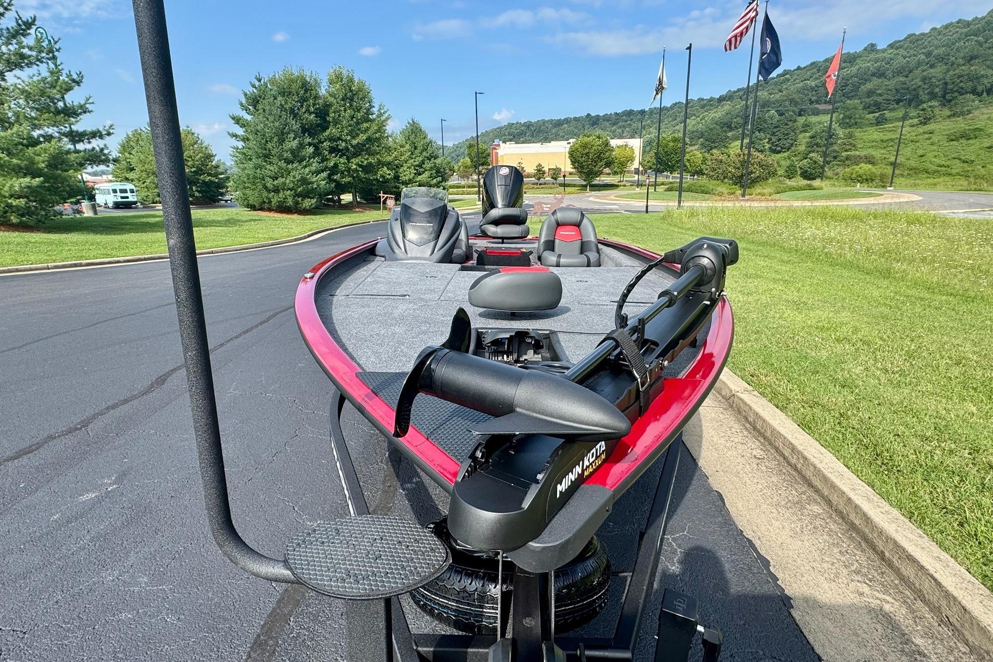2026 Tracker Savage 215 boat with Minn Kota motor on a sunny day.