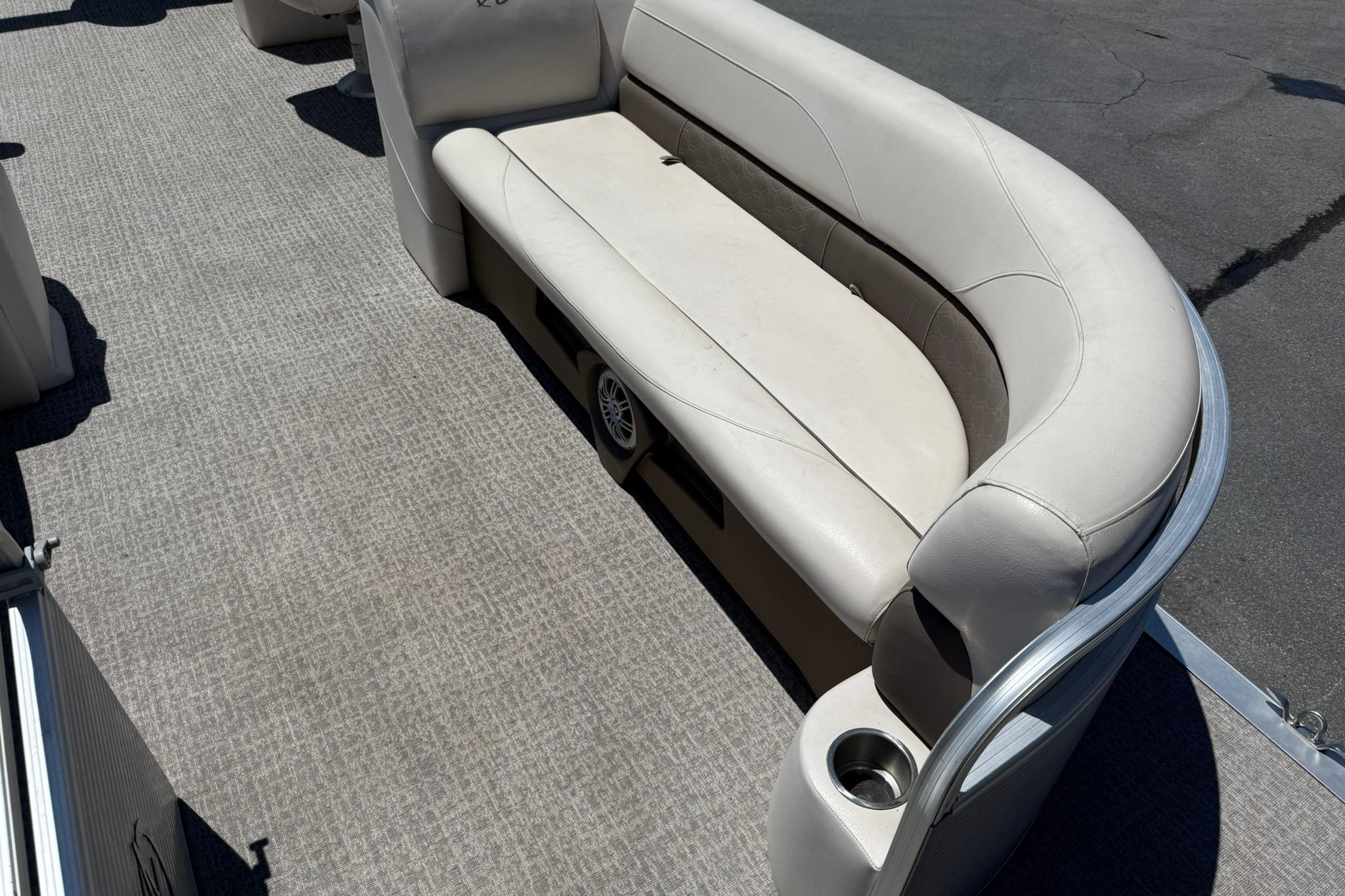 2019 Avalon GS Quad Lounge 25' boat interior with beige seating and cup holder.