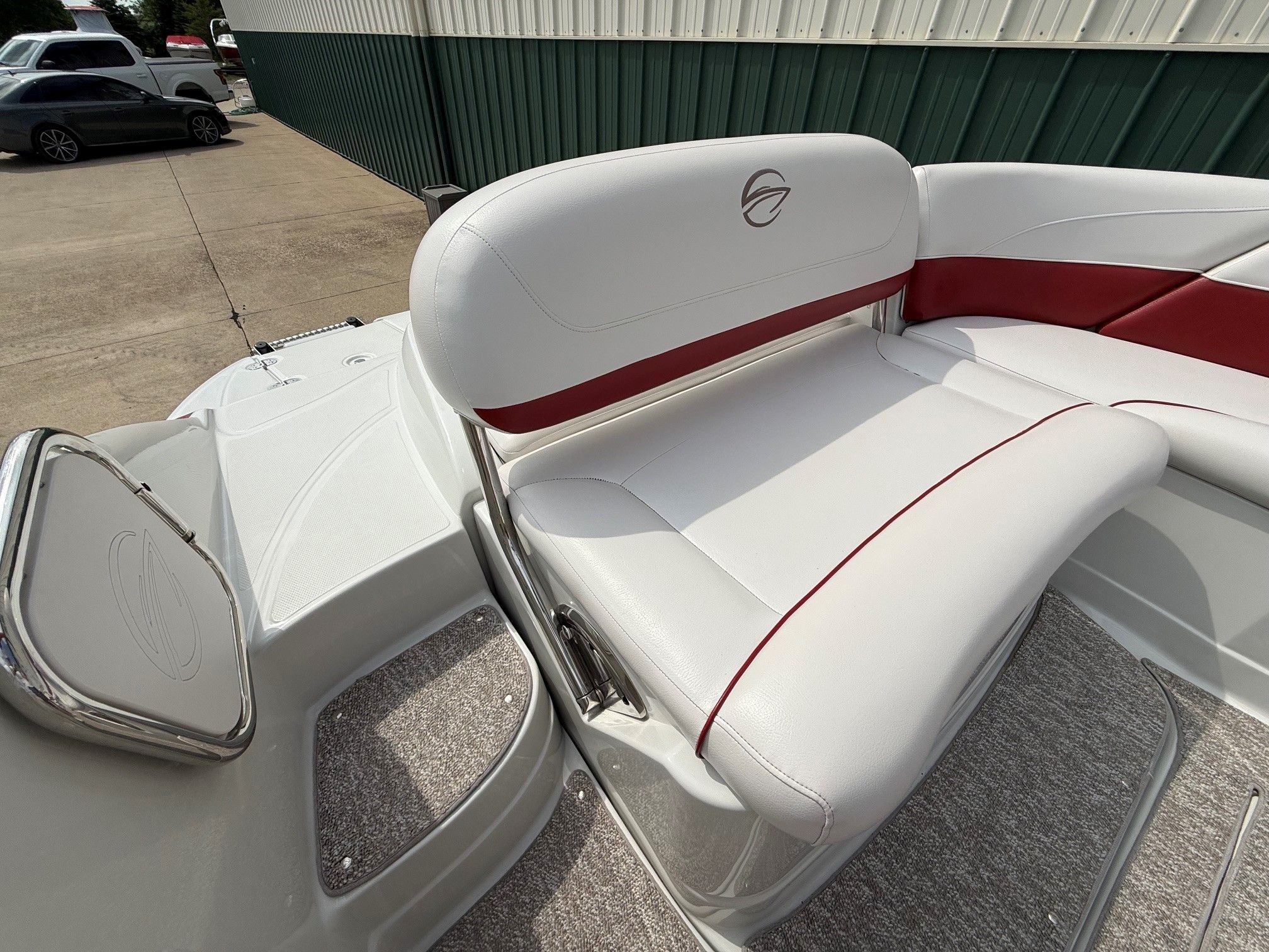 The image shows the white and red seating of a 2012 Crownline 252 EX boat.