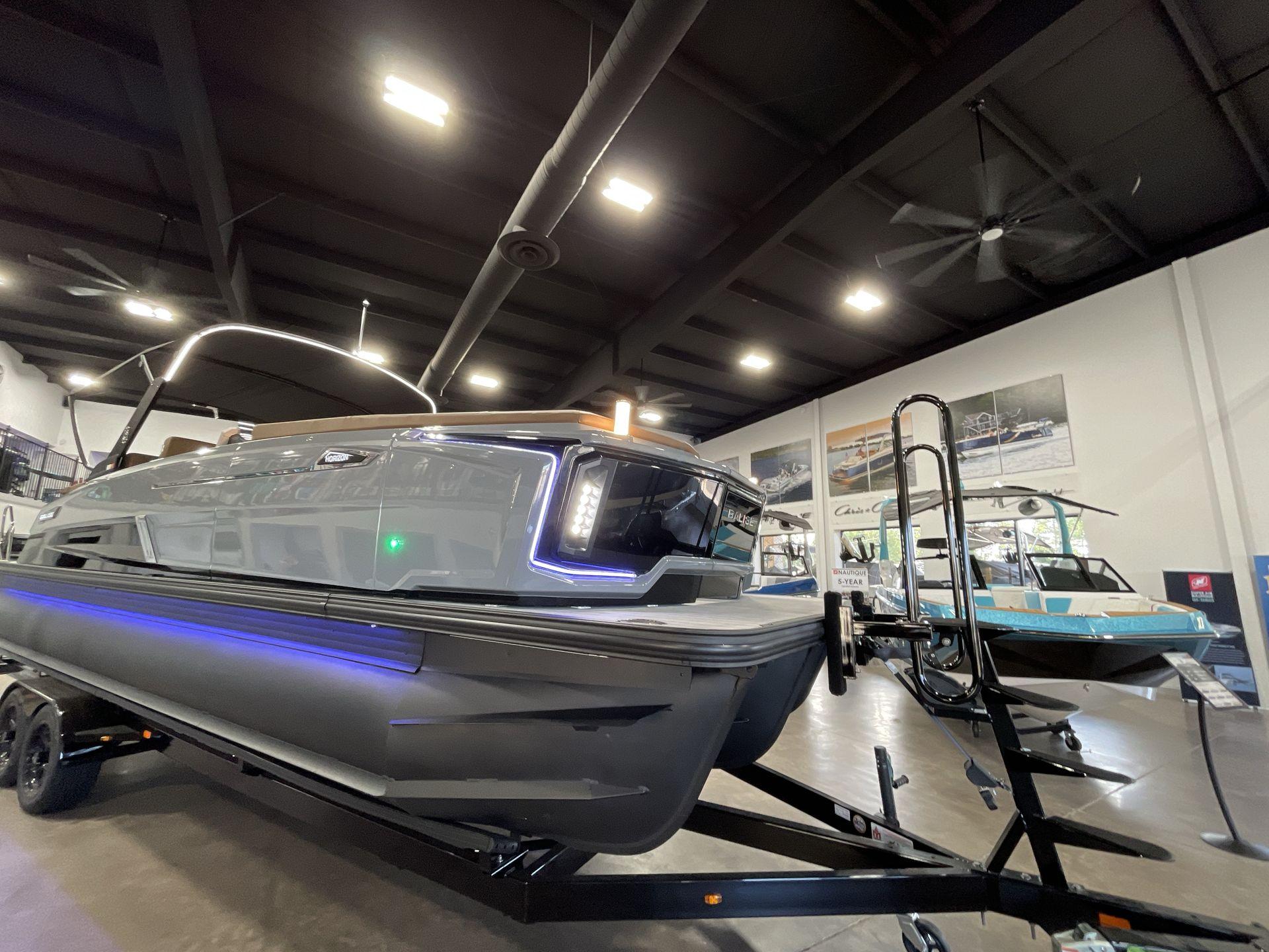 2025 Balise Horizon 26C boat displayed indoors with modern design and LED lighting.