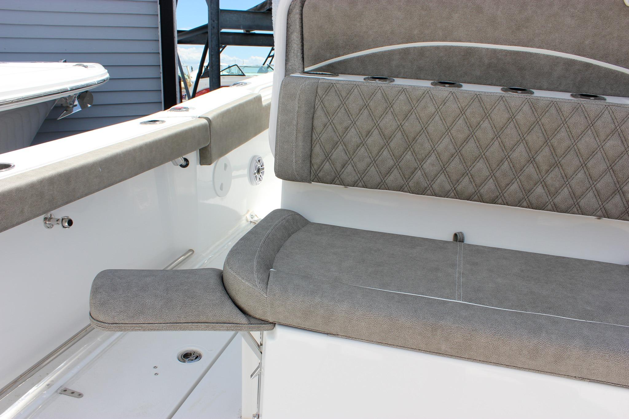 2027 Sea Hunt Ultra 275 Coffin Box boat interior with cushioned seating and storage.