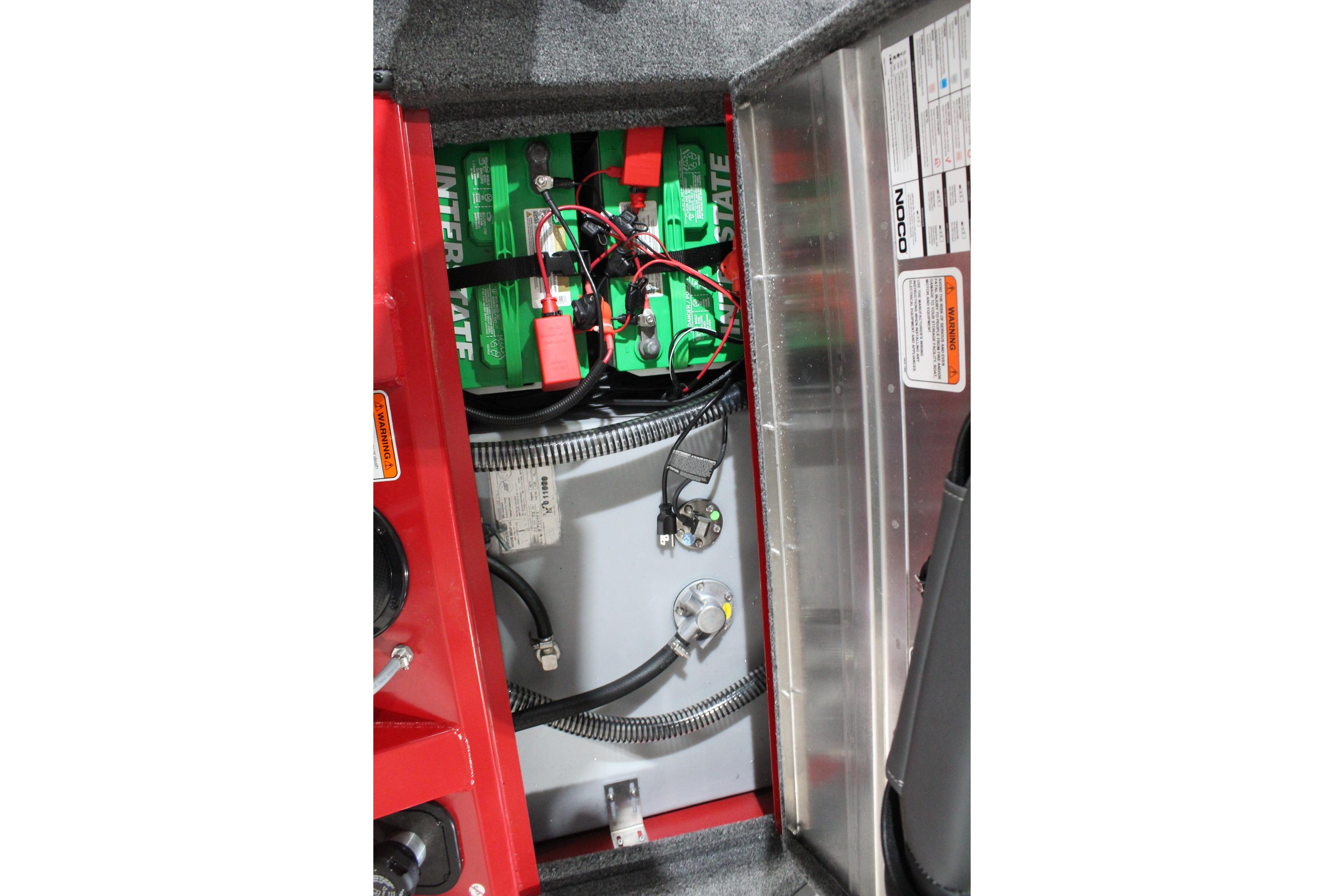 2026 Tracker Pro Team 175 boat battery compartment with wiring and labels.
