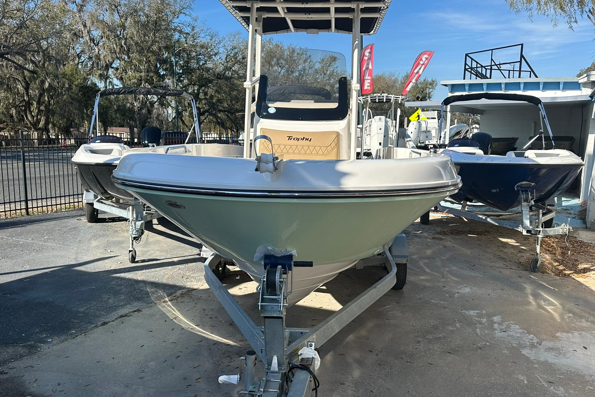 2026 Bayliner Trophy T20CC boat on trailer, displayed outdoors with other boats.