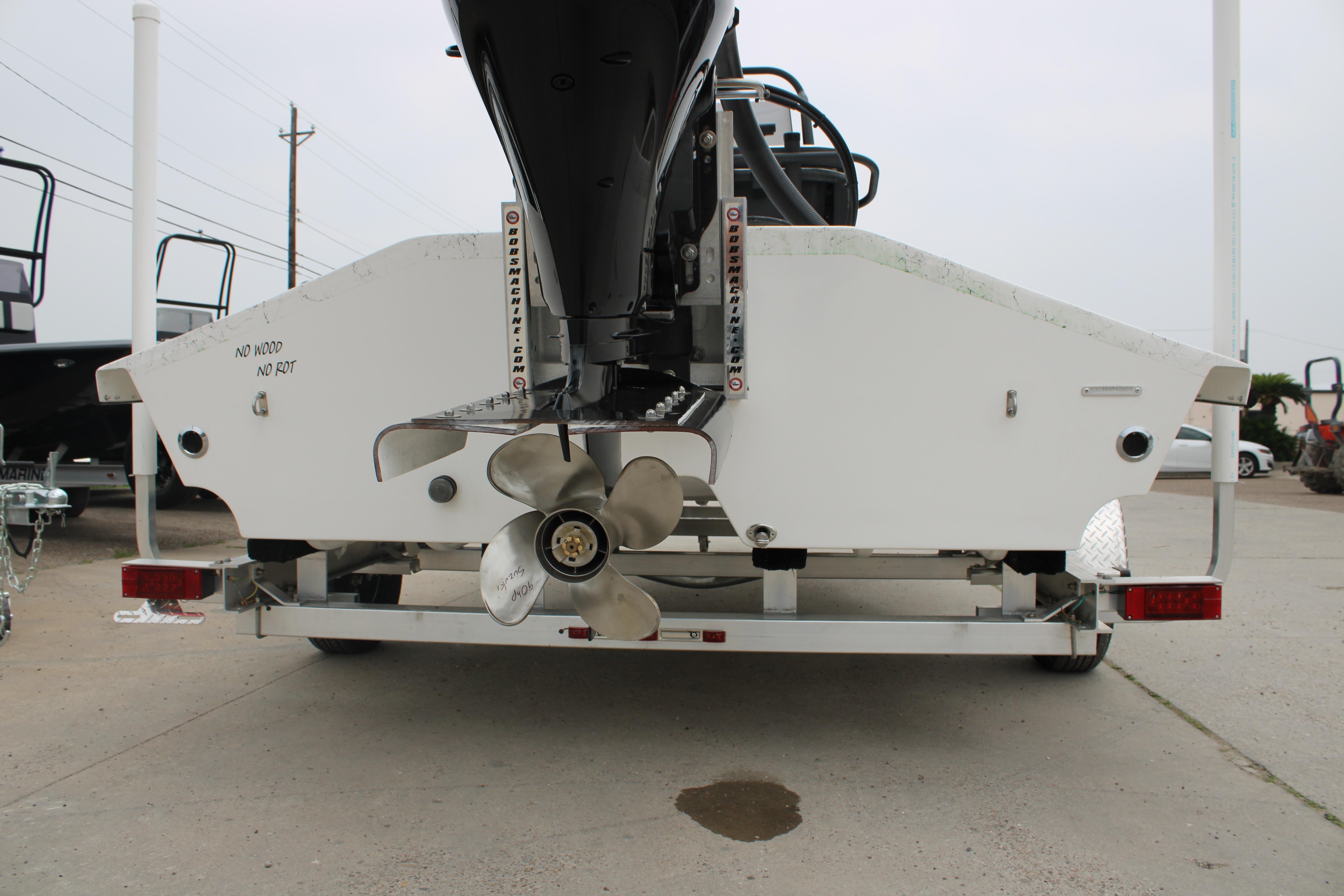 Rear view of 2026 Freedom Boats 16' Eagle on trailer, showcasing propeller and hull design.