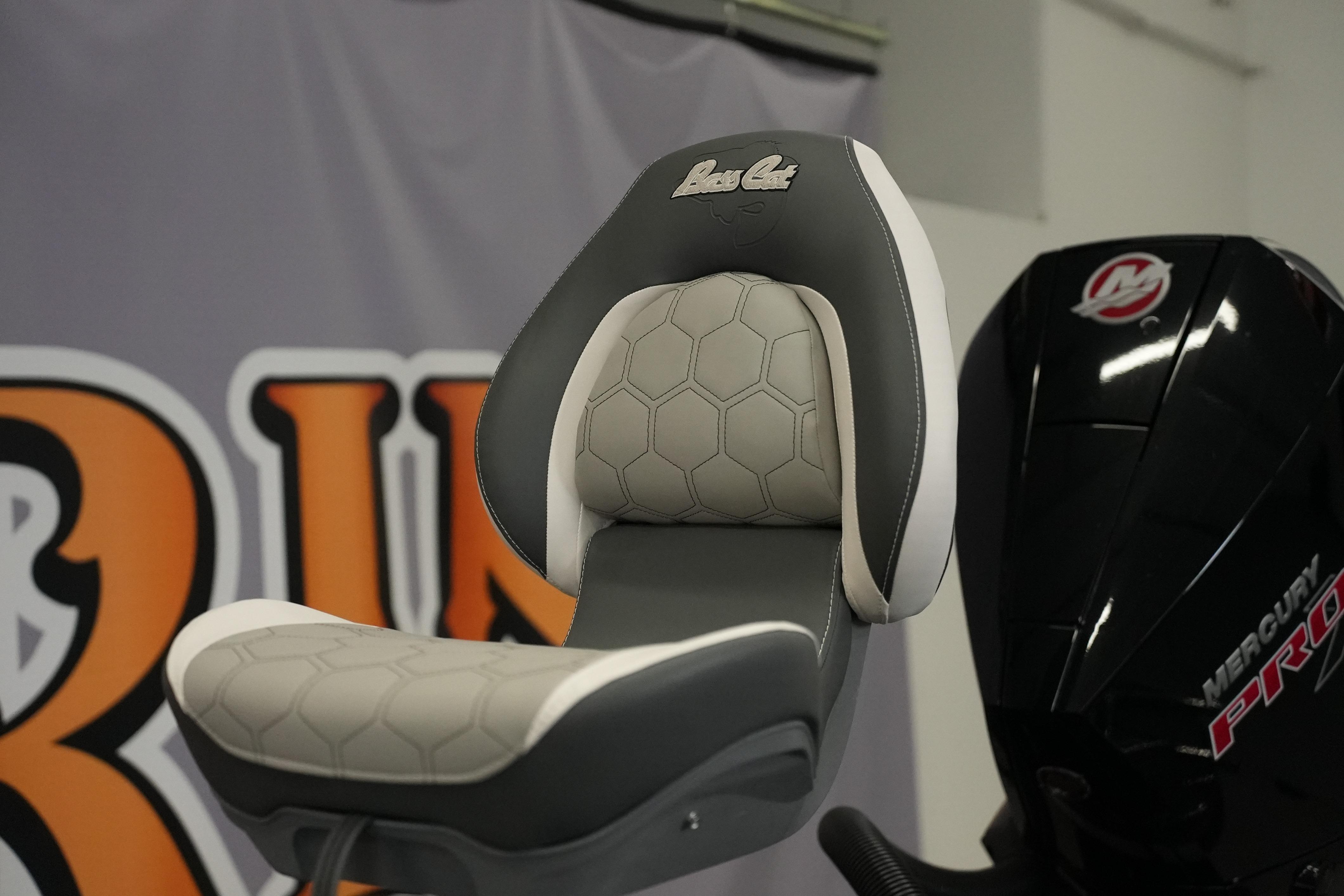 2026 Bass Cat Puma STS boat seat with hexagonal pattern and Mercury Pro engine.