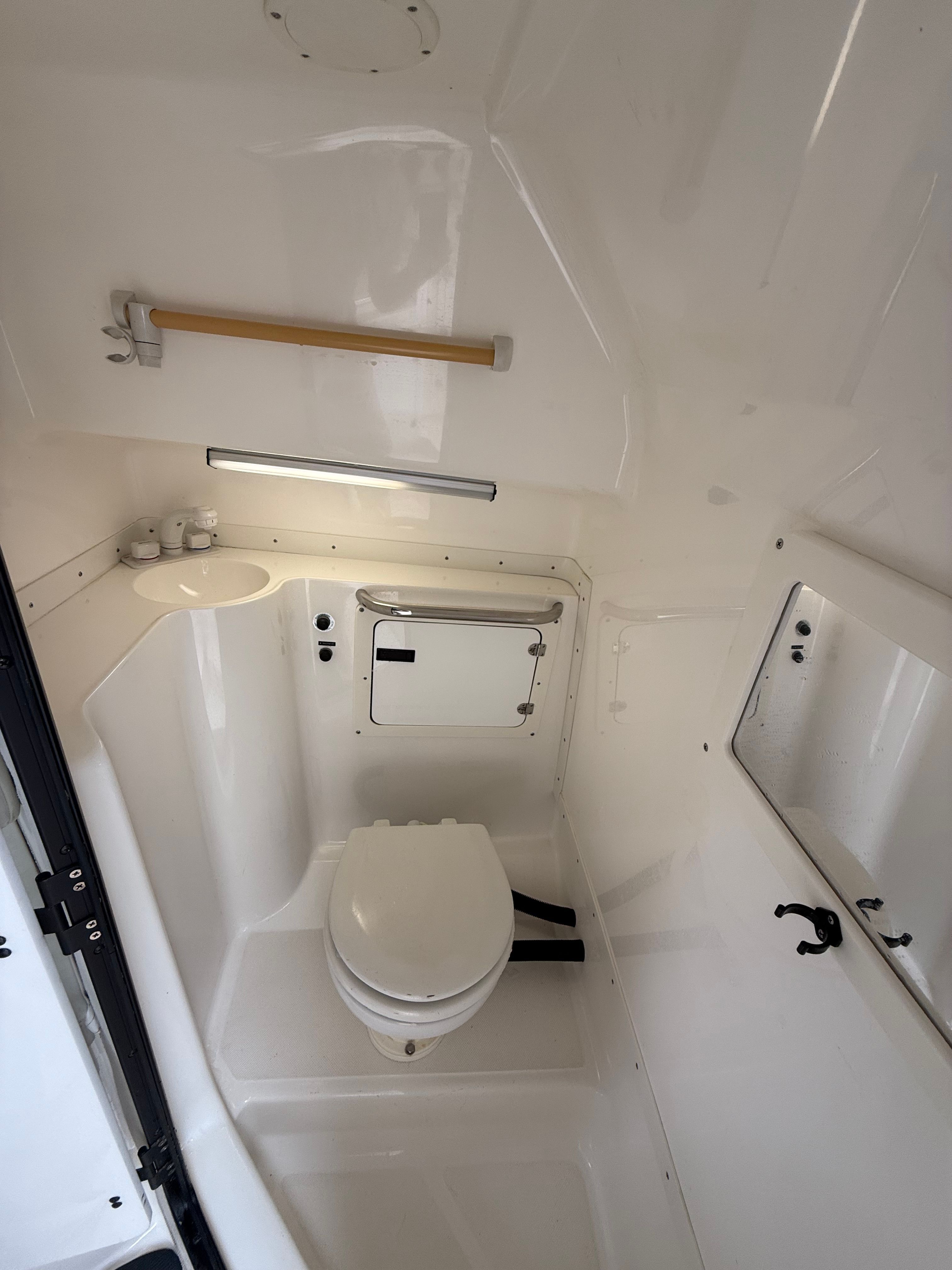 Interior of 1999 Fountain 32 Sport Fish Cruiser, bathroom view.