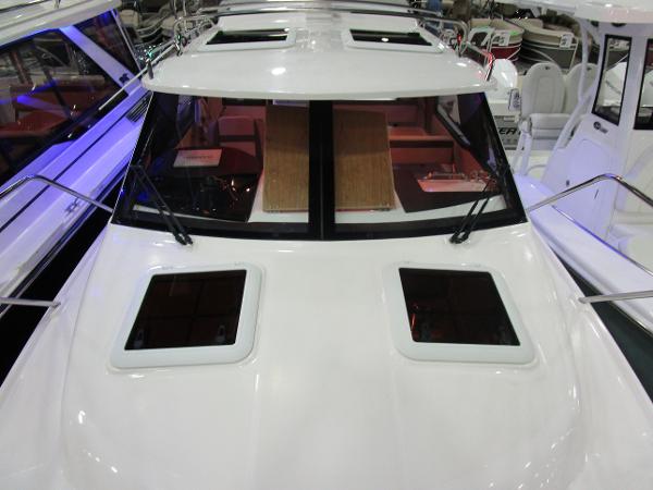 2025 Cutwater C-248 Coupe boat with sleek design and spacious cabin windows.