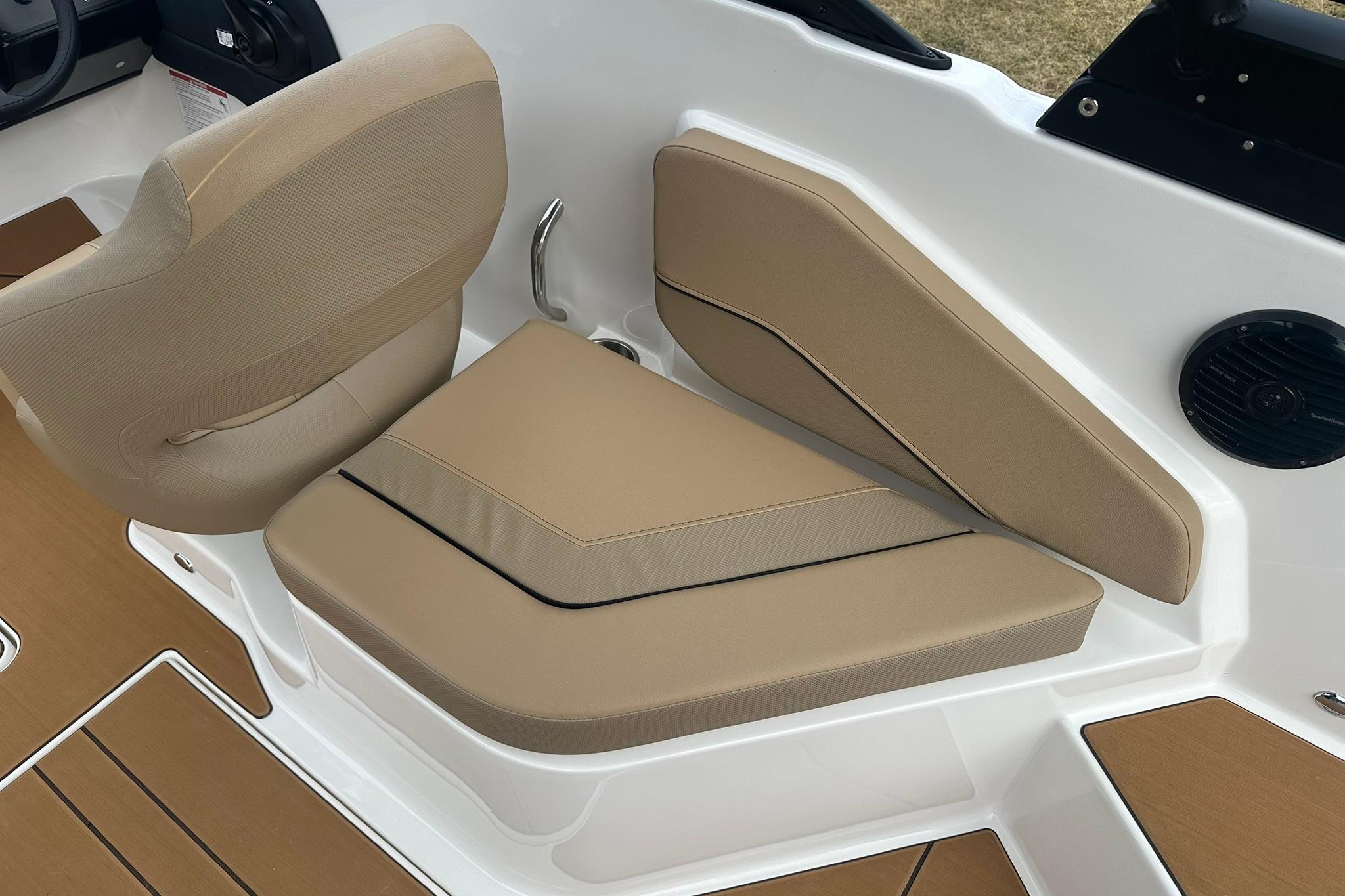 2026 Bayliner V20 boat interior with beige seating and modern design.
