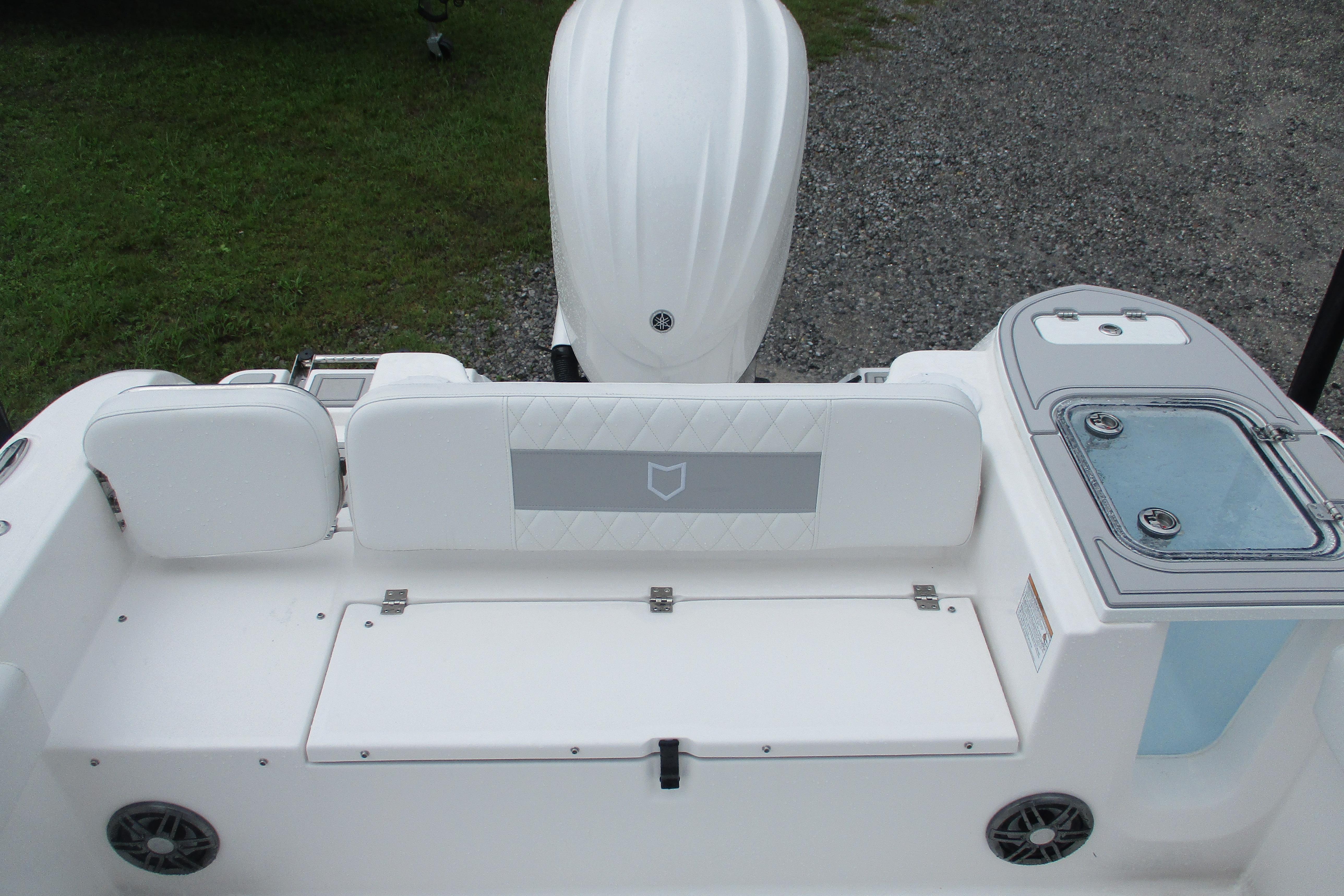 2026 Sea Fox 248 Commander boat interior with seating and storage compartments.