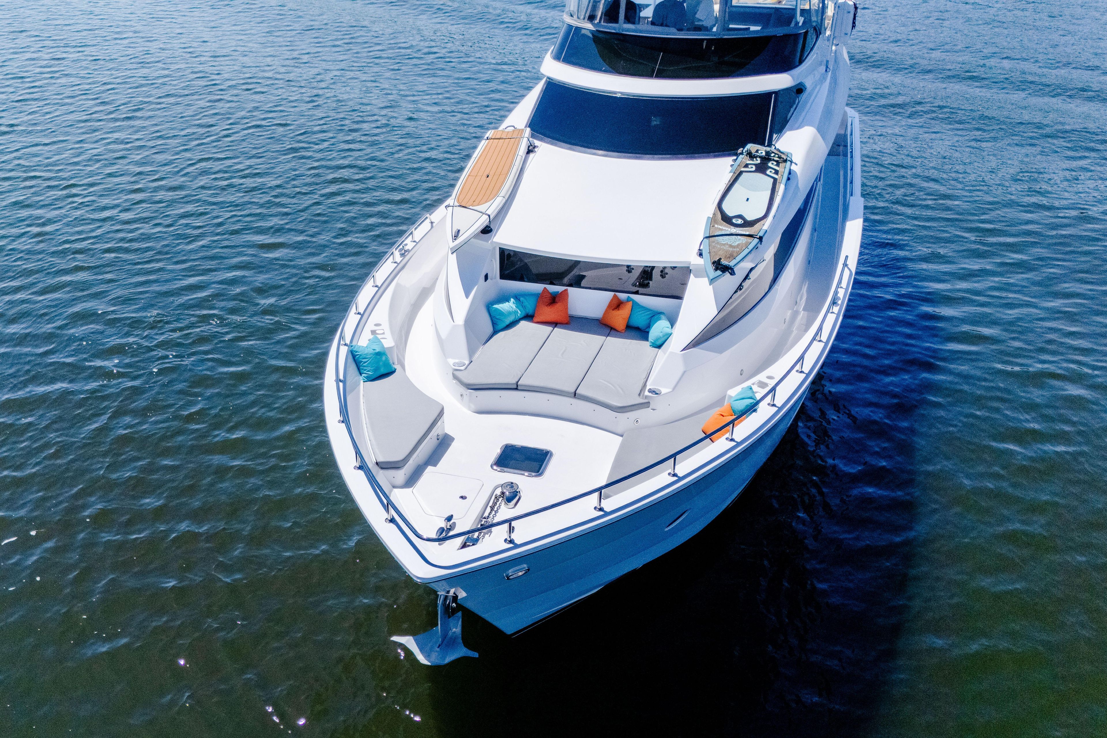 2021 Hatteras M75 Panacera yacht with luxurious deck seating on calm water.