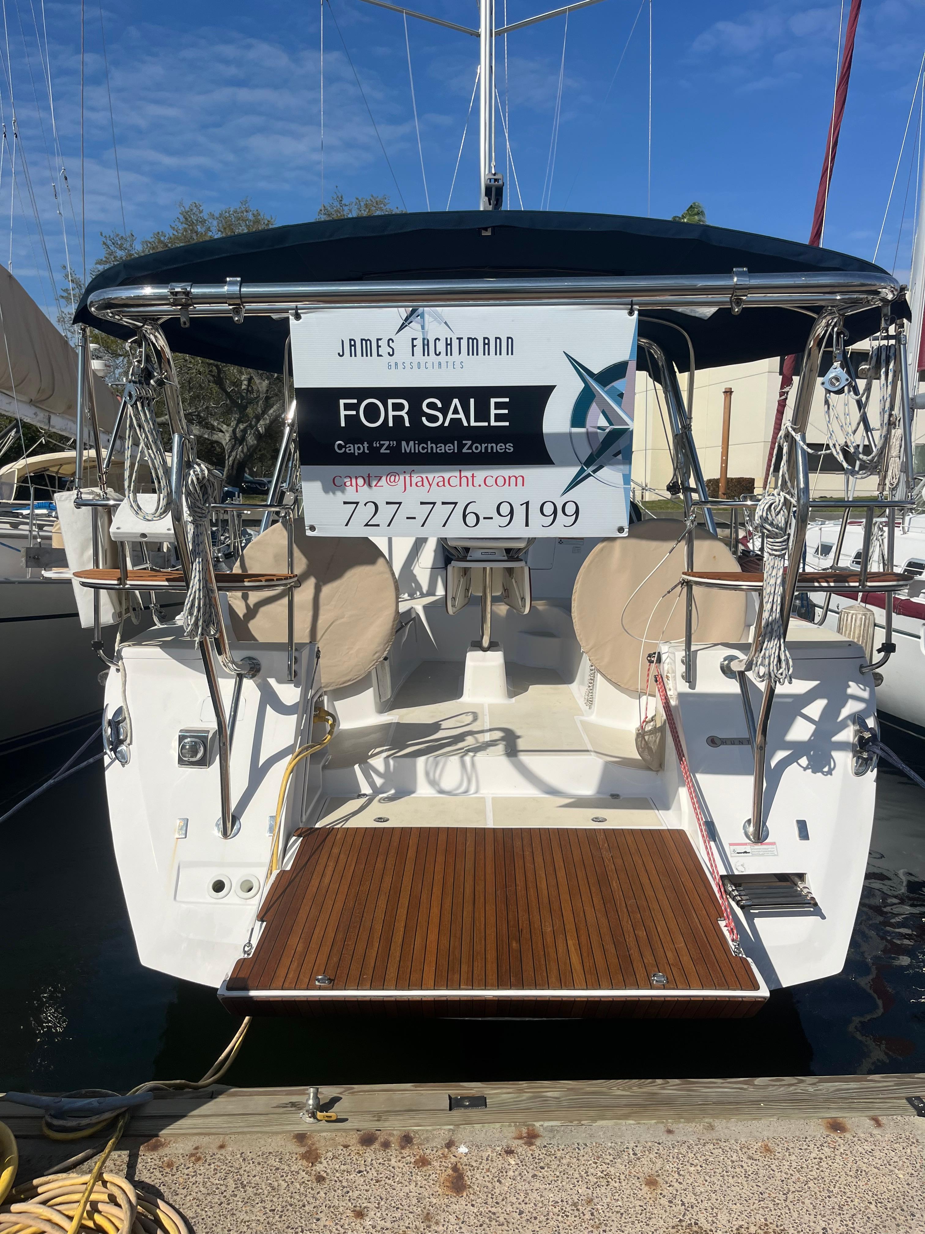 2015 Marlow-Hunter 40 yacht for sale, docked with contact information displayed.