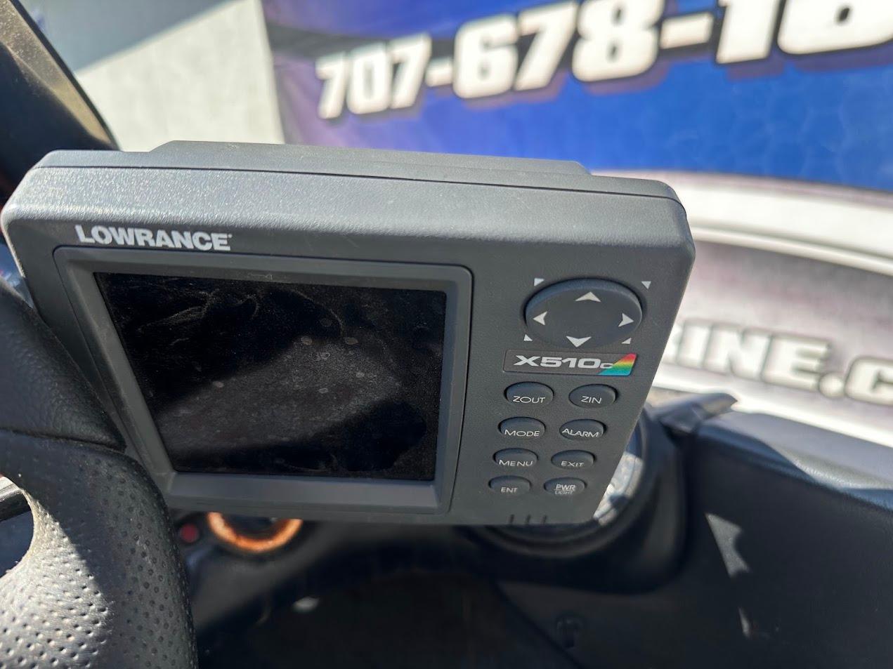 Lowrance X510 fish finder on a 1999 Fisher 21 FX DC boat dashboard.
