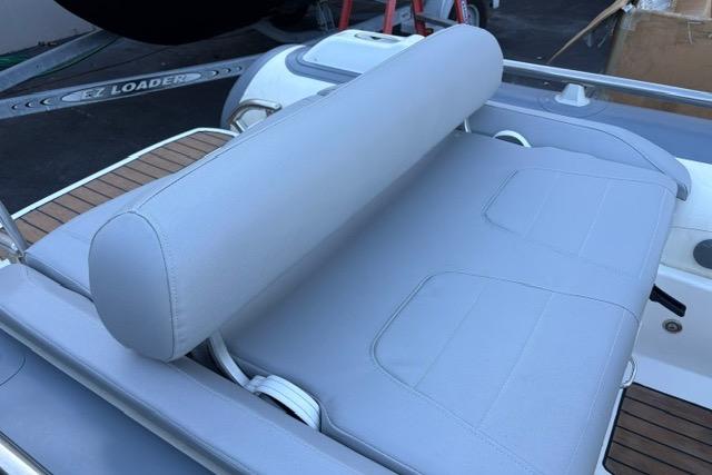 2018 Williams 345 Sports Jet boat with gray cushioned seating and teak deck accents.