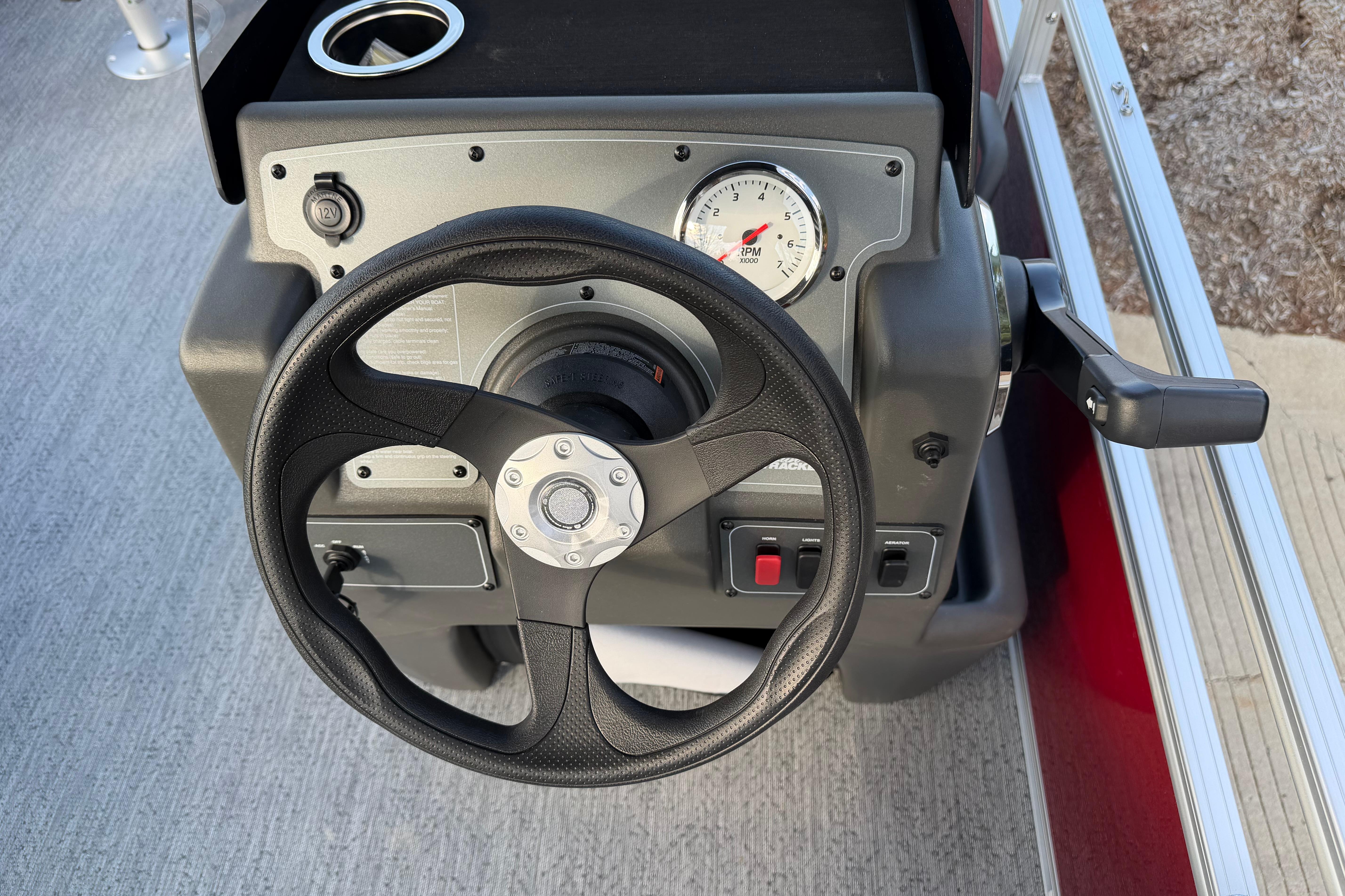 Steering console of 2026 Sun Tracker Bass Buggy 18 DLX pontoon boat.