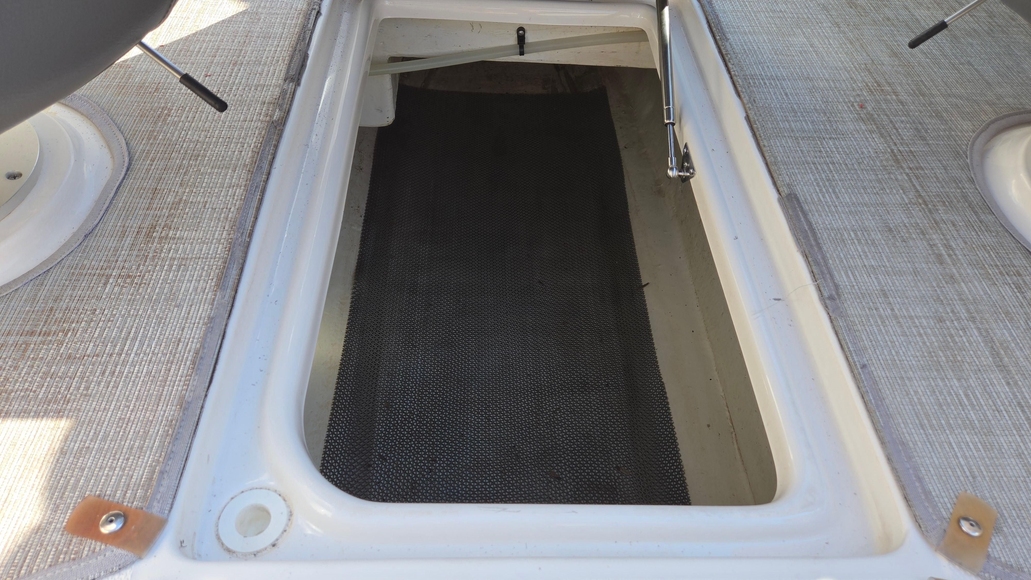 Open storage compartment on 2018 Chaparral 224 Sunesta boat deck.