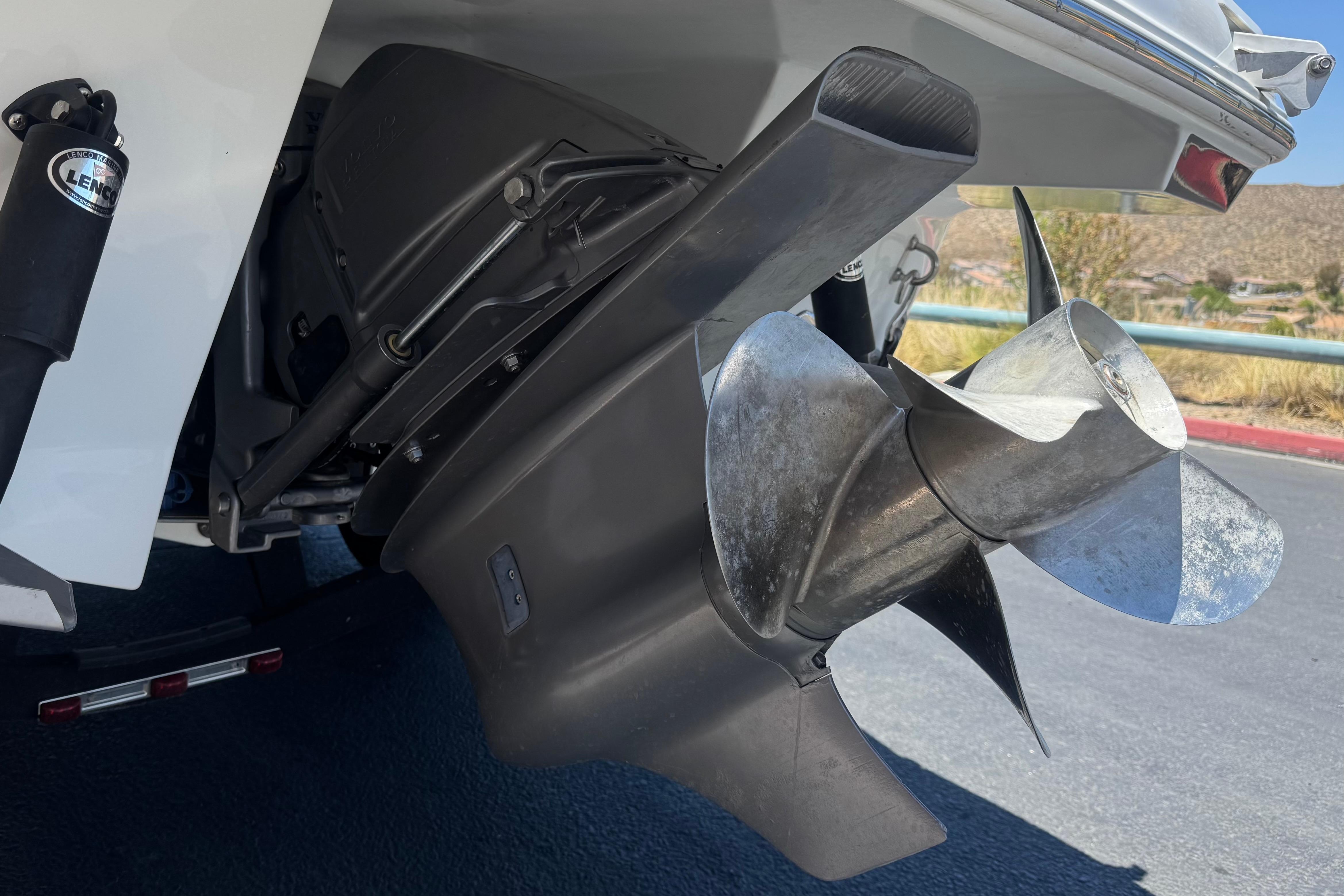 Close-up of a 2022 Four Winns H4 boat propeller and stern drive.