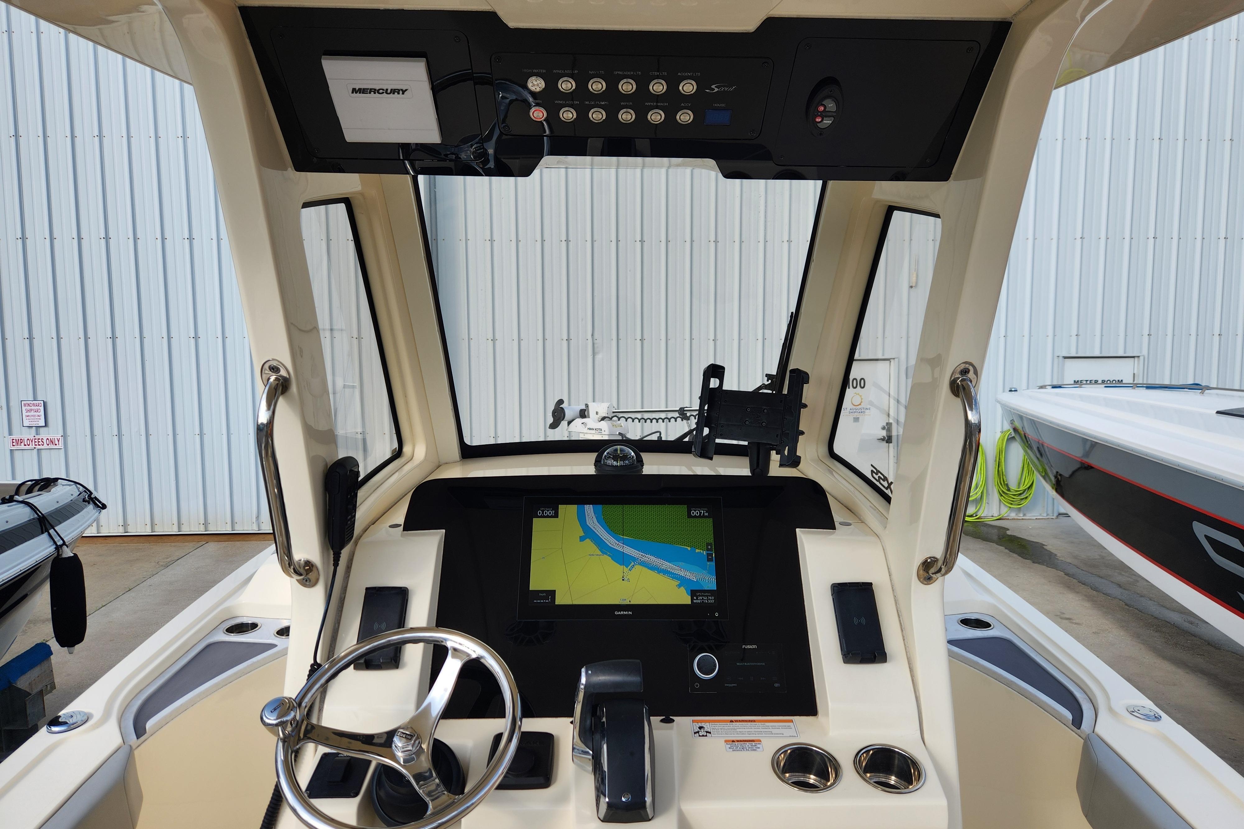 2024 Scout 281 XSS boat dashboard with navigation display and steering wheel.