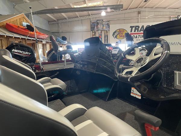 2025 Nitro Z18 Pro boat interior with steering wheel and seating in showroom.