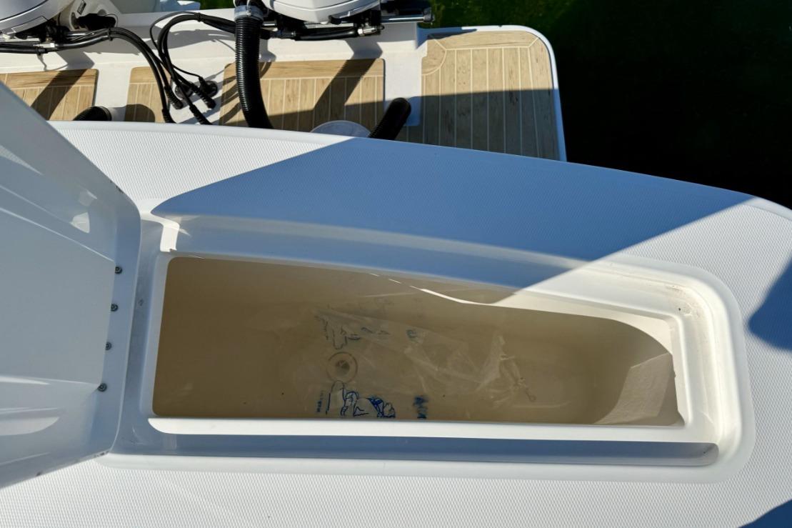 Open storage compartment on 2019 Regulator 31 boat deck.
