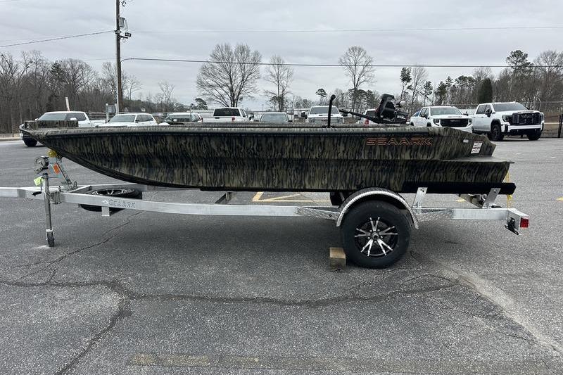 2026 SeaArk 1752 Slayer X boat on trailer in parking lot.