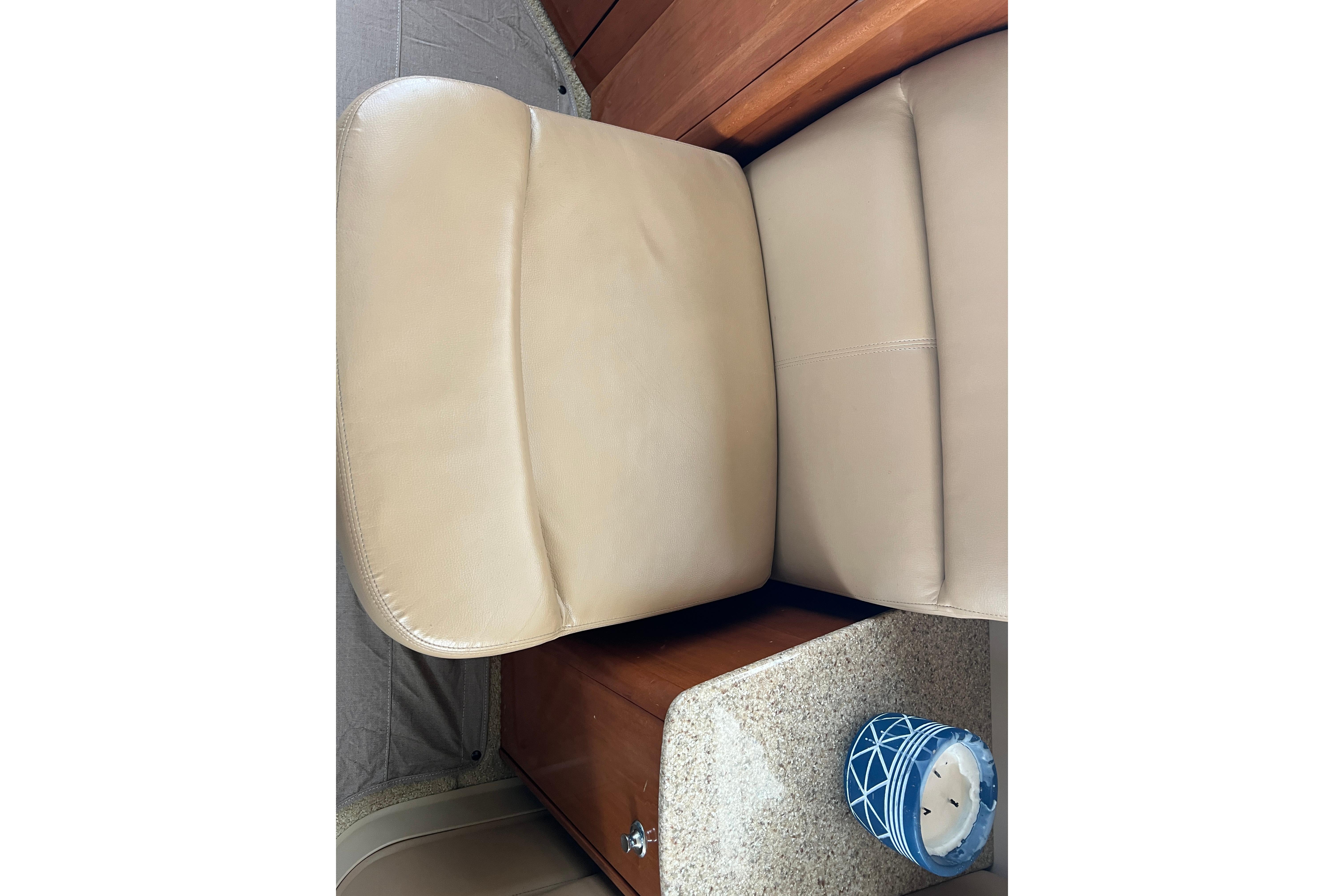 Beige leather seating in 2007 Meridian 391 Sedan interior with blue decorative candle.