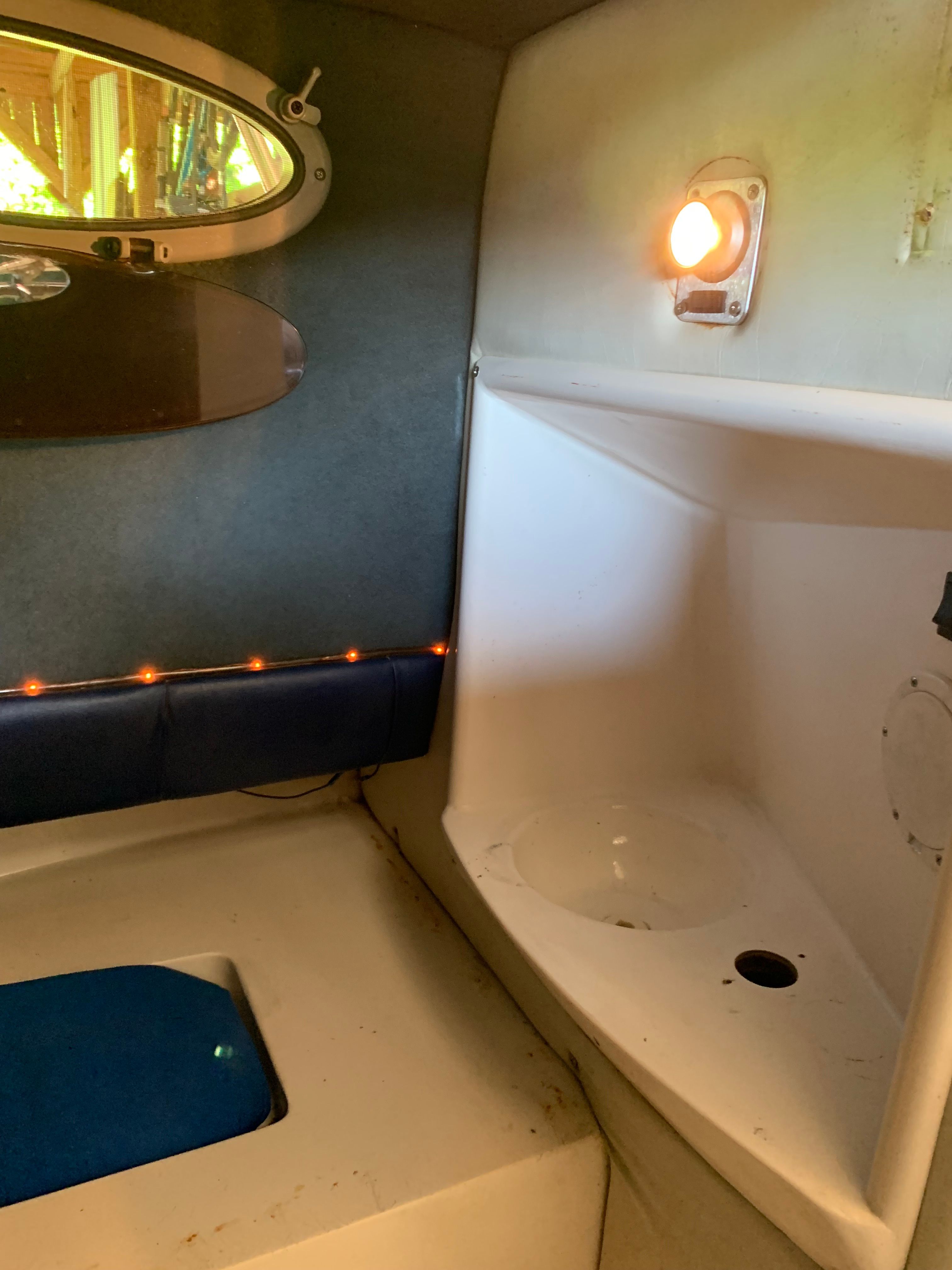 Interior of a 1998 Eurosport 221WA boat with lighting.