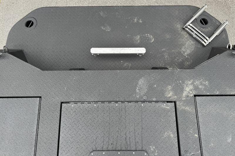 2026 SeaArk Predator 300 AK boat deck with textured surface and metal fittings.