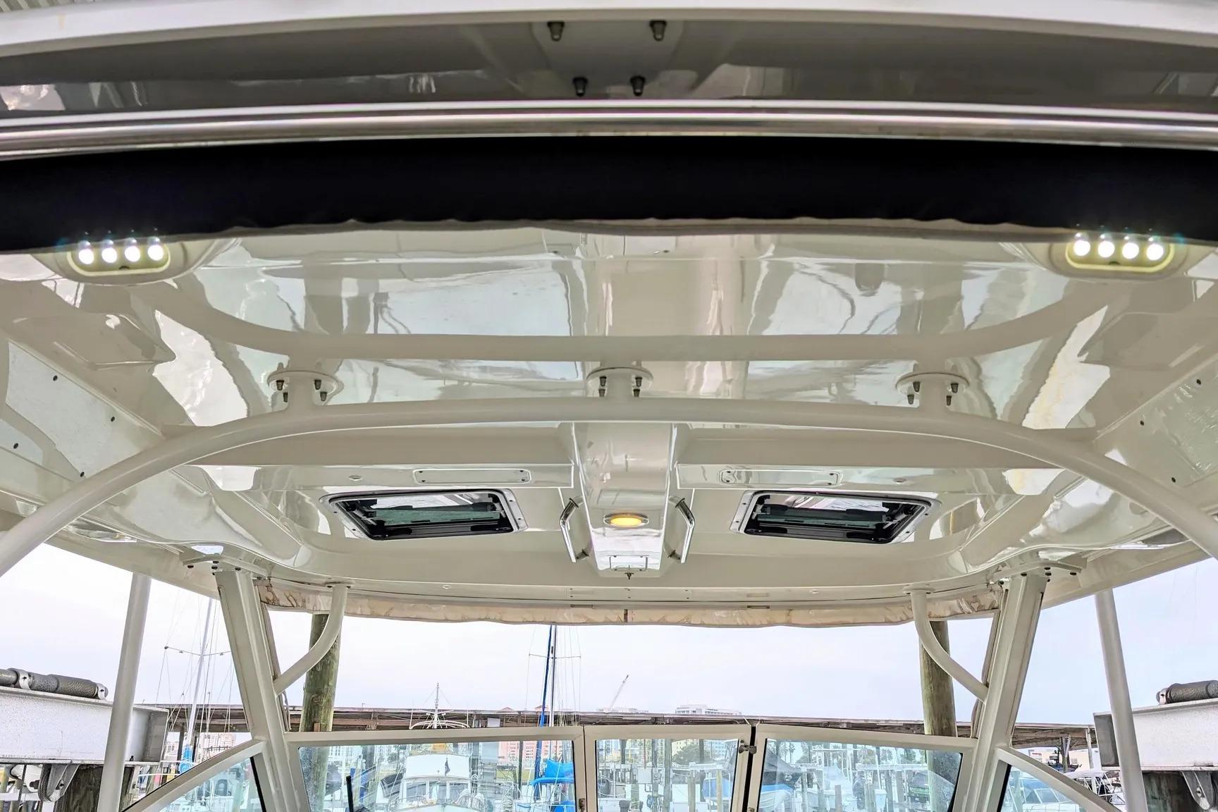 2017 Boston Whaler 320 Vantage boat interior roof with lights and hatches.