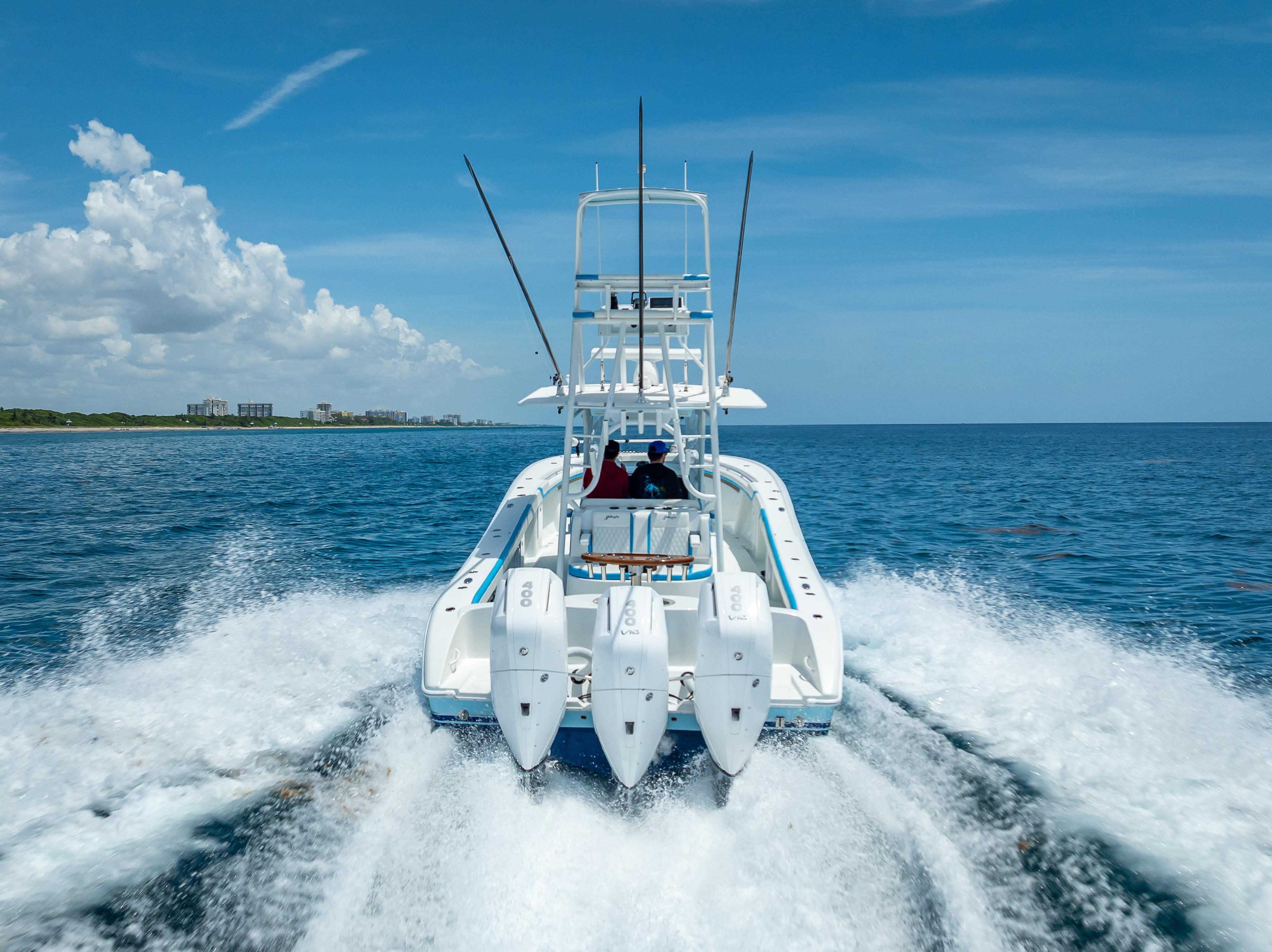 2016 Yellowfin 39 Offshore boat cruising on open ocean under clear blue sky.
