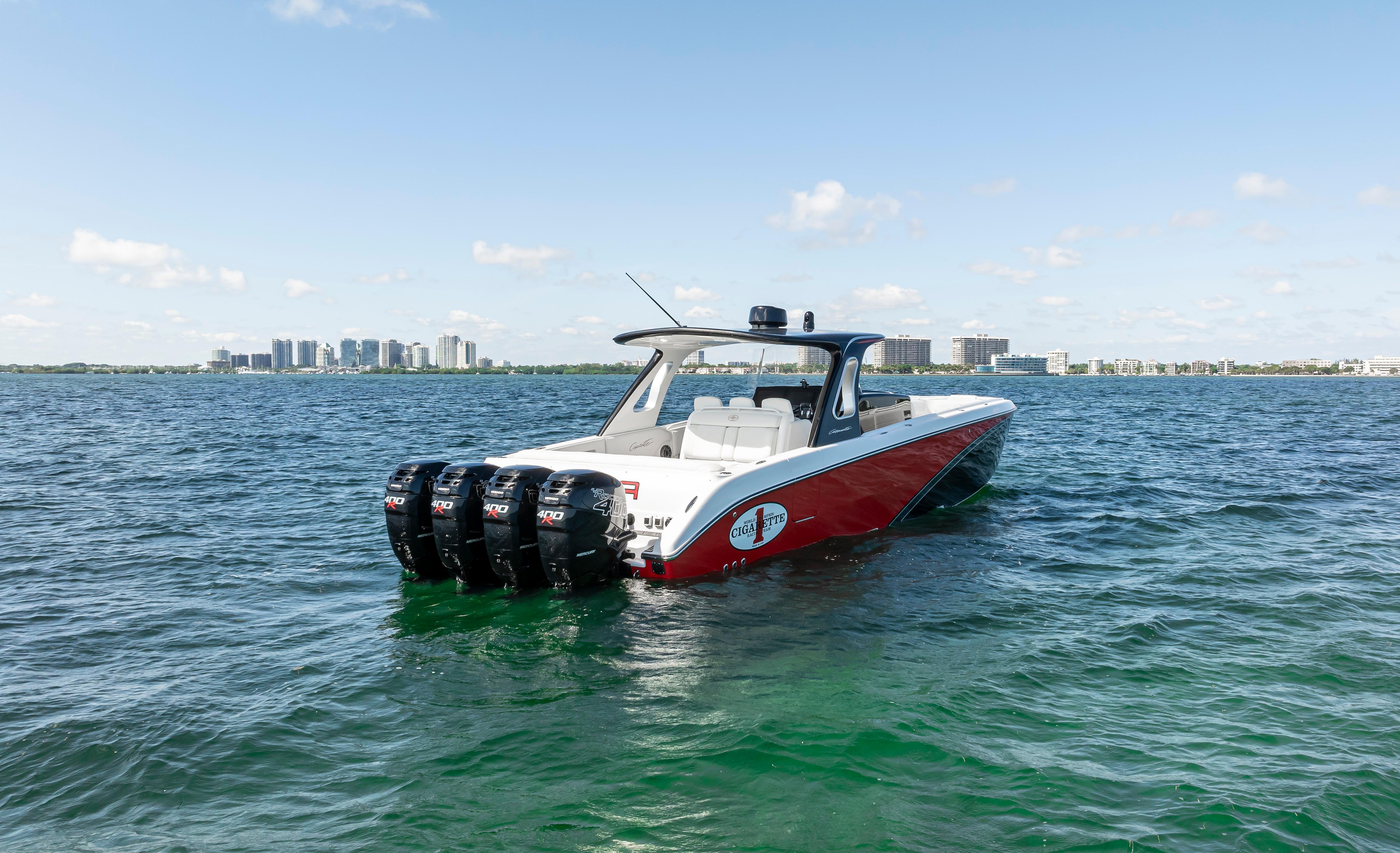 2016 Cigarette 41 GTR boat on open water with city skyline in background.