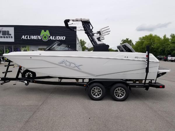 2023 ATX Surf Boats 20 Type-S on trailer outside Acumen Audio store.
