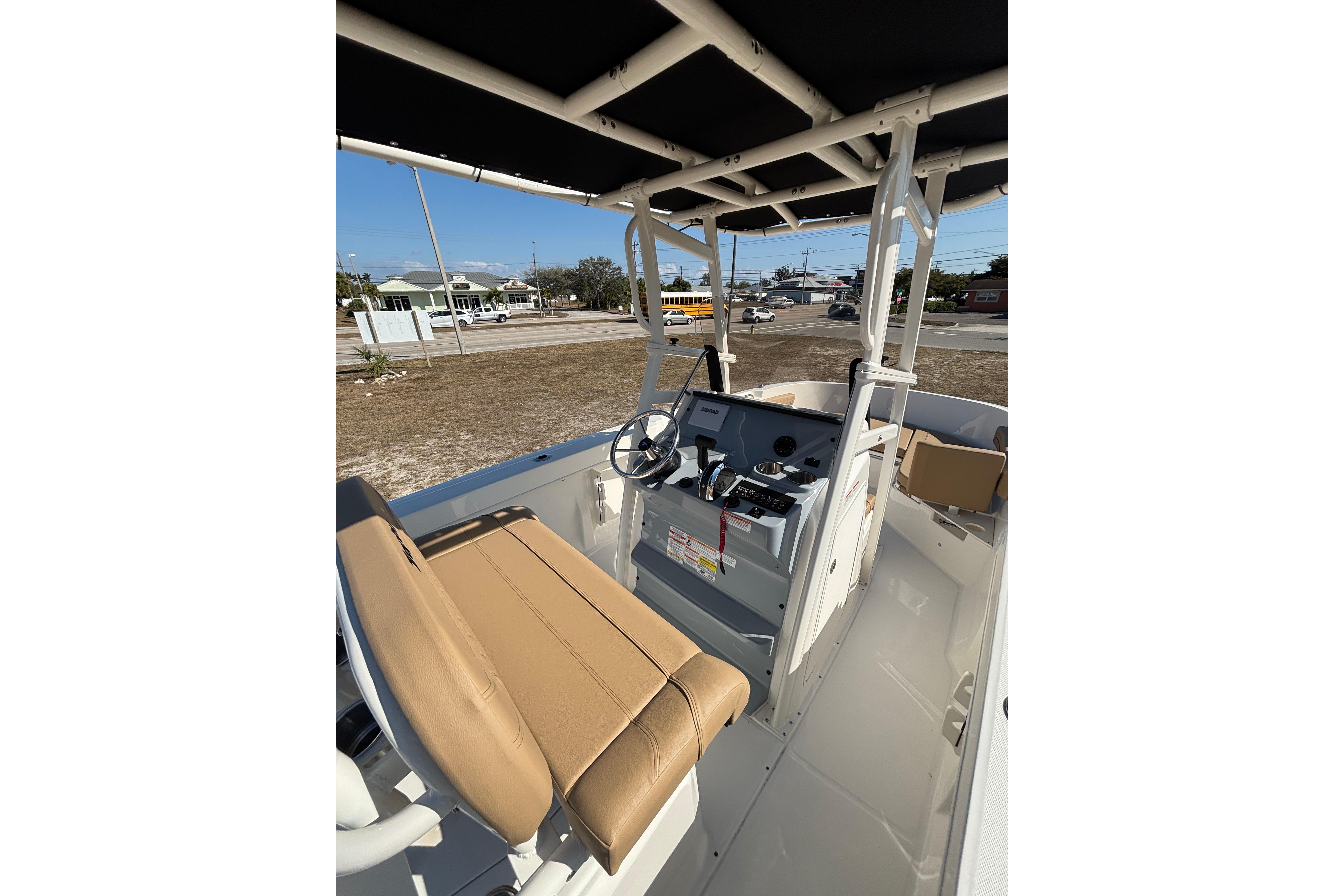 2026 Bayliner Trophy T22CC boat interior with helm and seating, showcasing modern design.