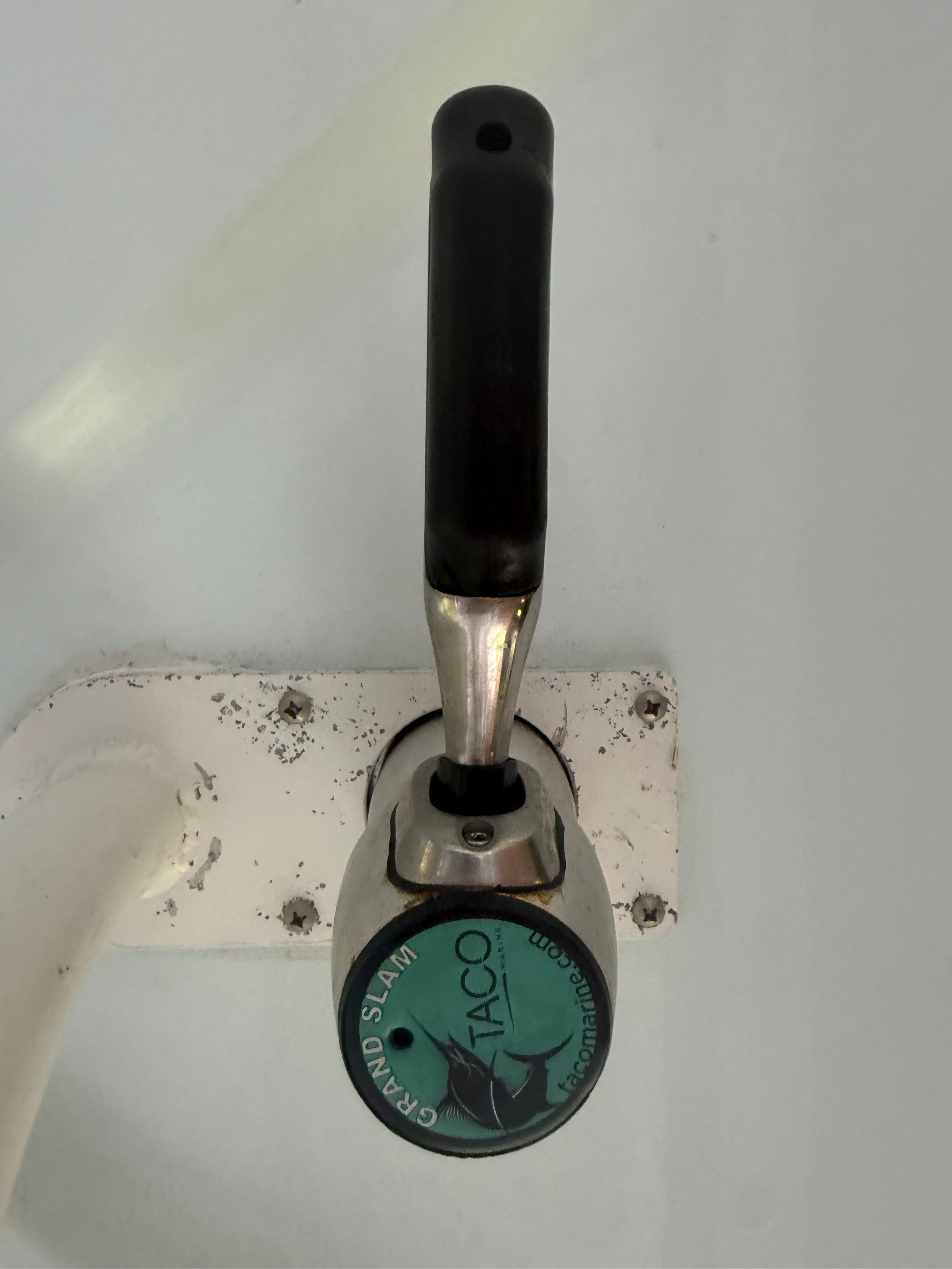 Close-up of a boat lever labeled "TACO Grand Slam."