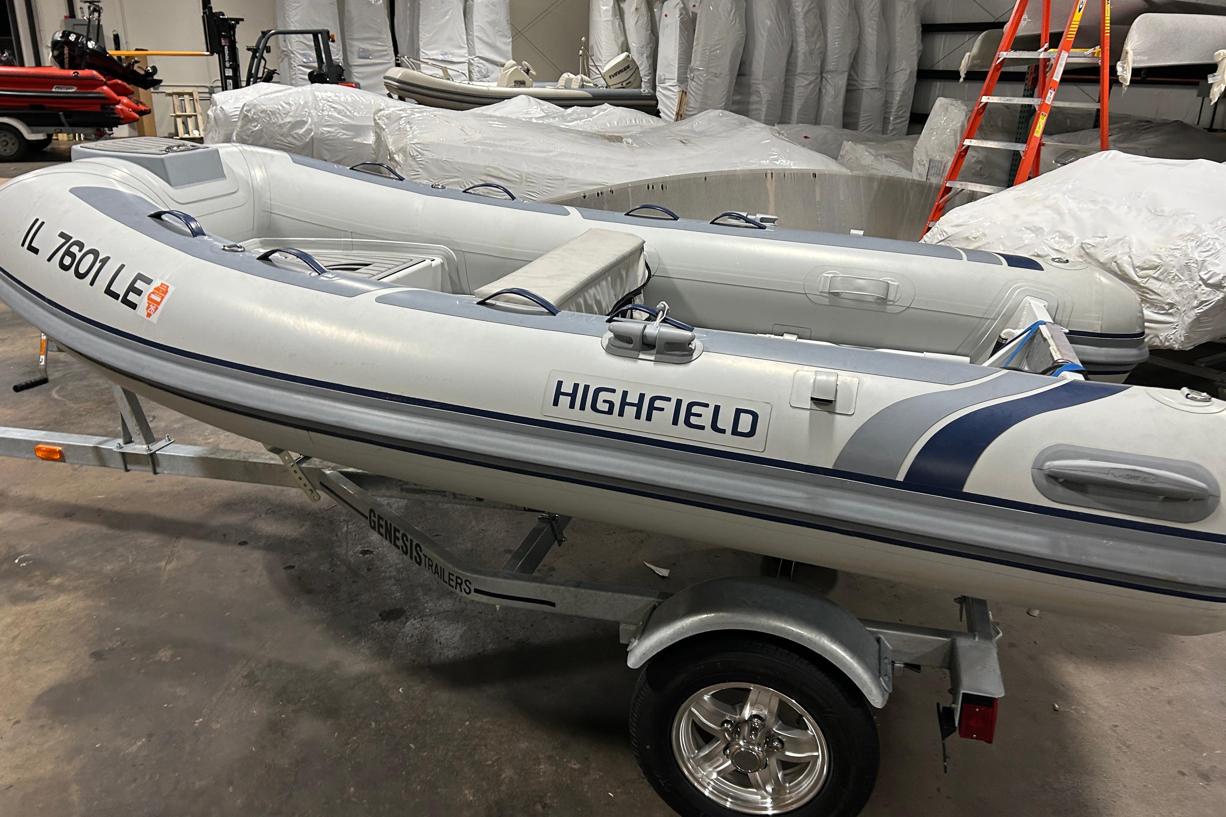 2023 Highfield Classic 310 inflatable boat on trailer in a storage facility.