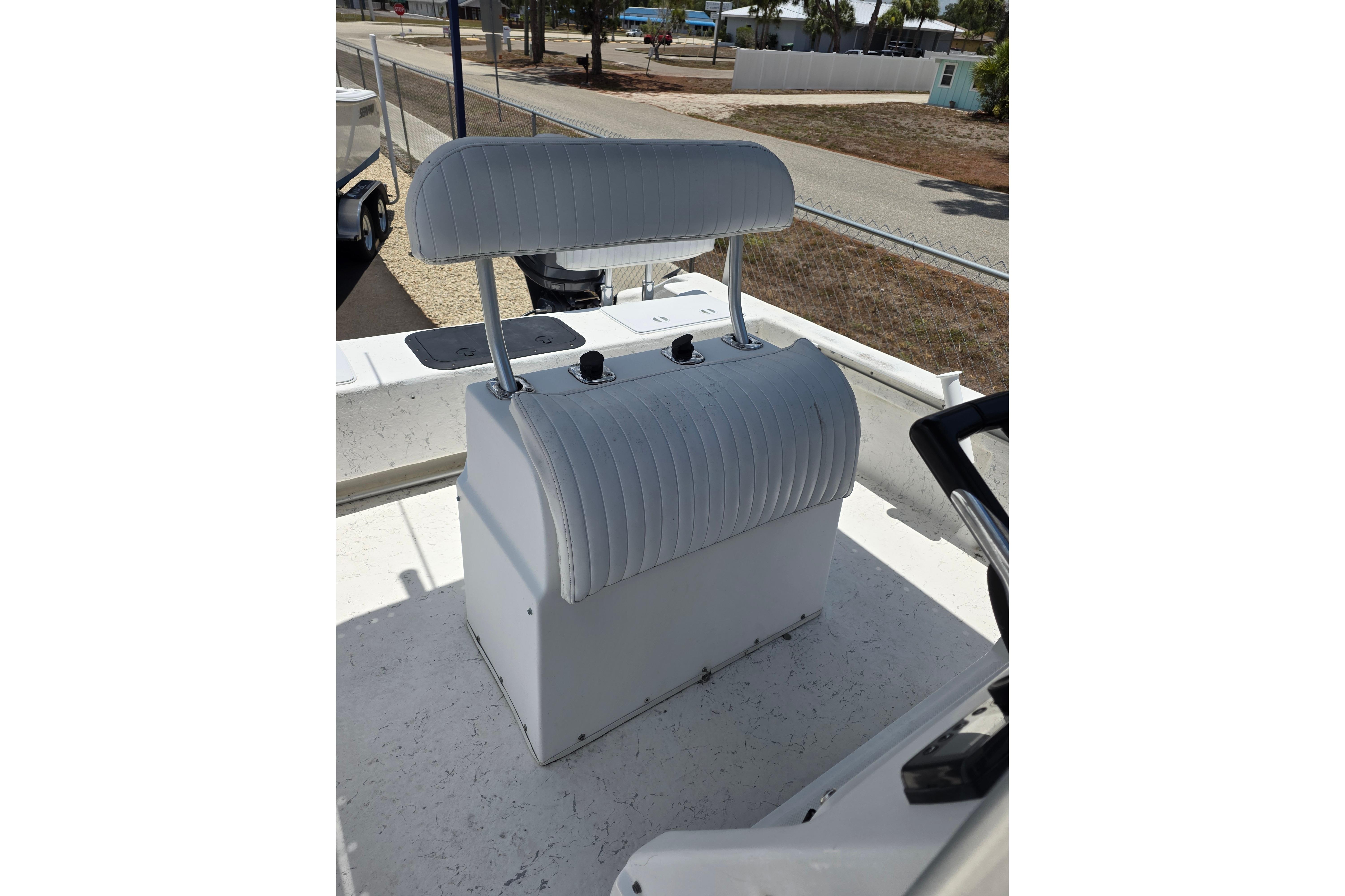 Twin Vee Awesome 22 boat seat, 1999 model, white upholstery, outdoor setting.