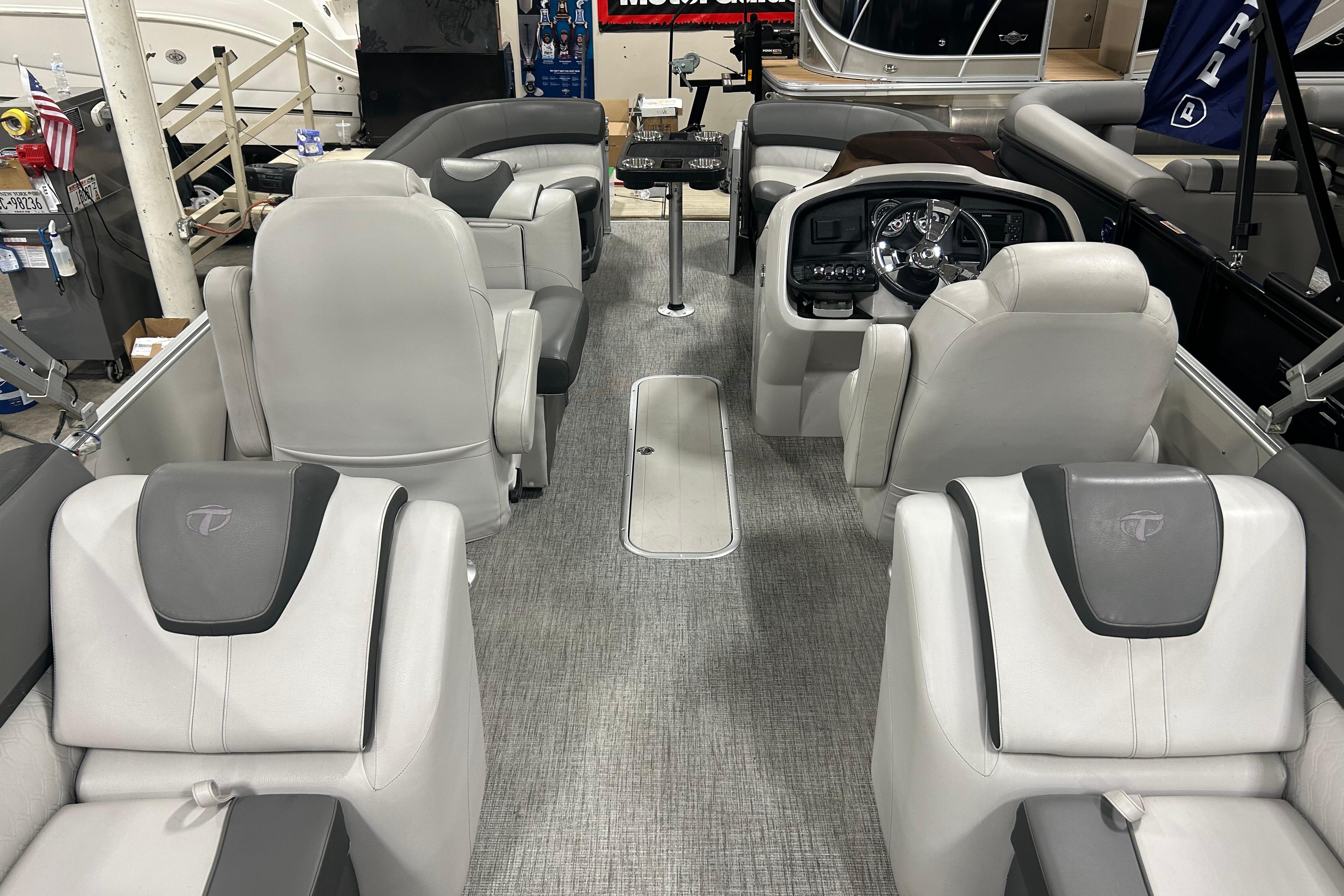 2022 Tahoe Pontoon Cascade Quad Lounger interior with luxurious seating and modern dashboard.